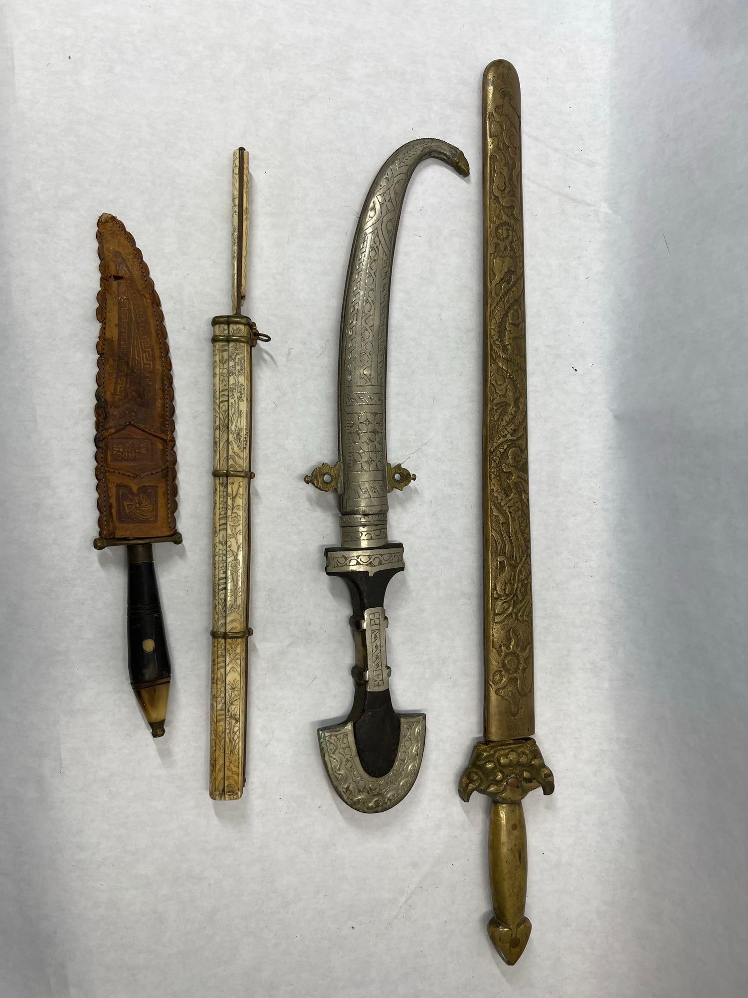 An Assortment of International Edged Weapons Including Moroccan Koummya and Chinese Seven Star (1 of 14)