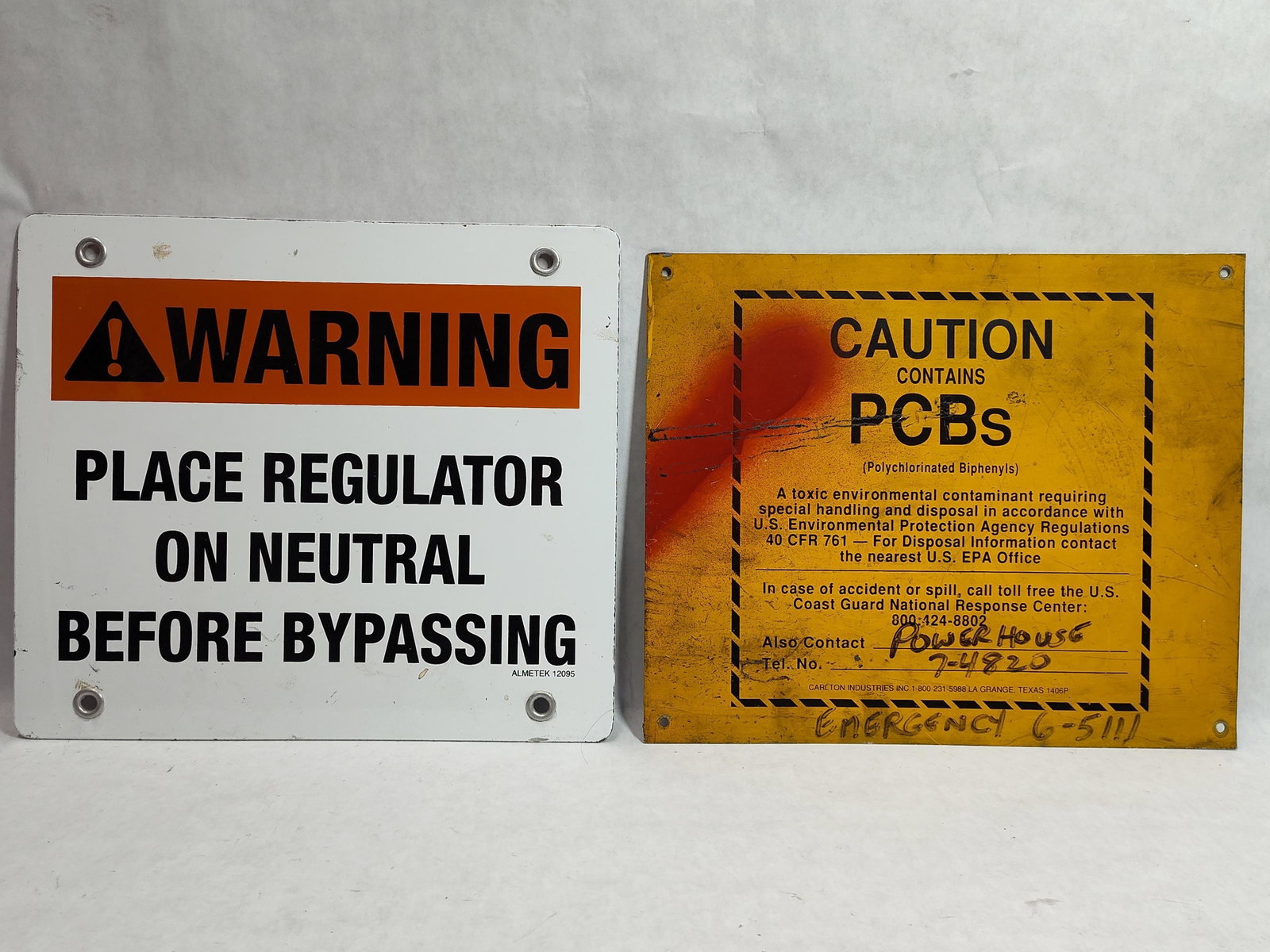 Pair Metal Safety Signs: Electrical & PCB: This lot consists of two industrial metal safety signs used for electrical maintenance and hazardous material regulation. The first sign is an electrical regulator warning sign produced by Almetek, be