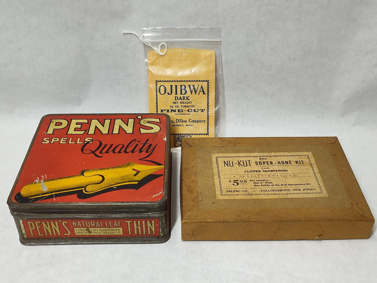 American Advertising Collectibles & Tool Kit: This lot features three mid-20th-century American items including two tobacco advertising containers and a professional tool kit. The first item is a lithographed tin for Penn's Natural Leaf Thin