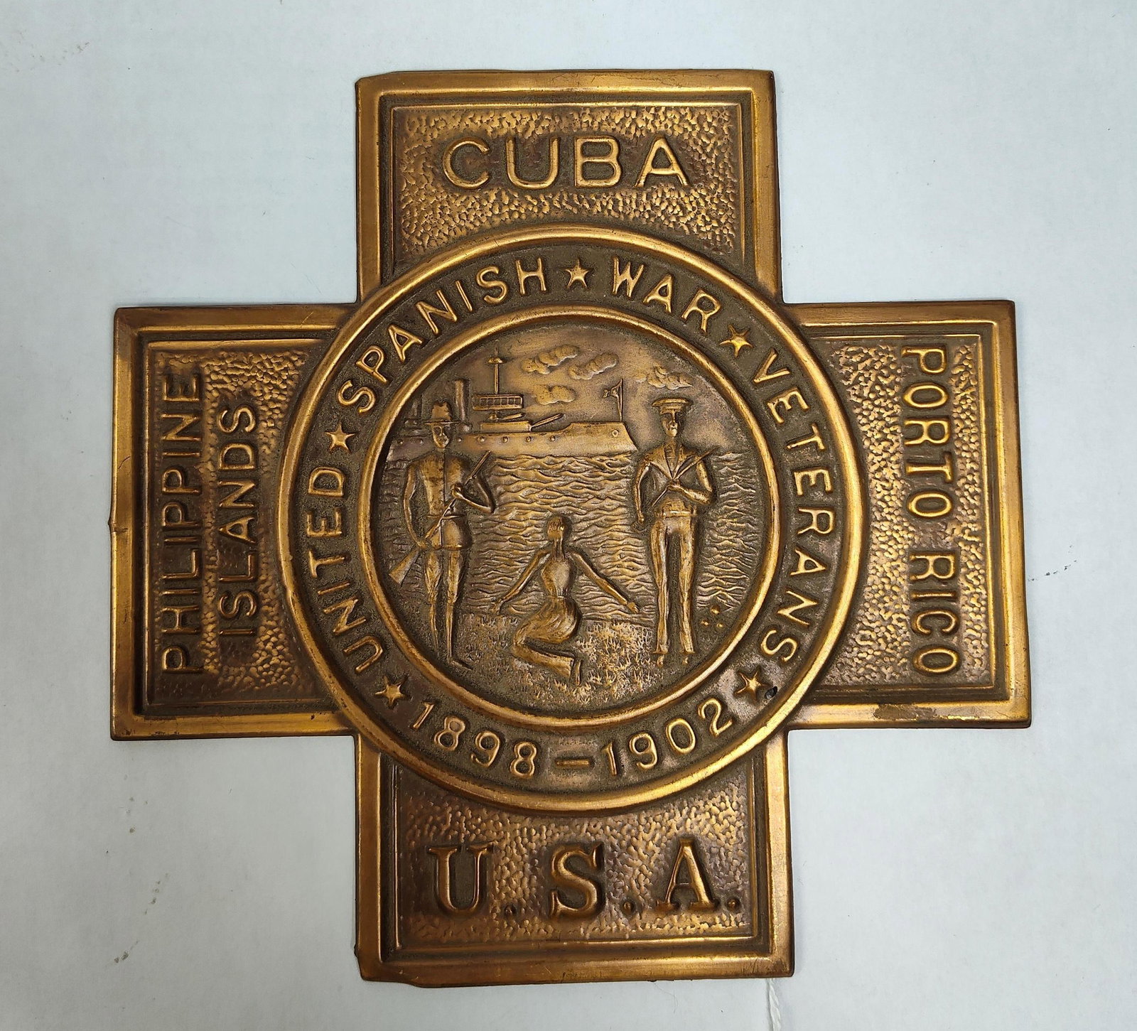 United Spanish War Veterans Bronze Cross Plaque: This commemorative plaque or grave marker is associated with the United Spanish War Veterans (USWV), honoring service during the Spanish-American War and the Philippine-American War. The item is