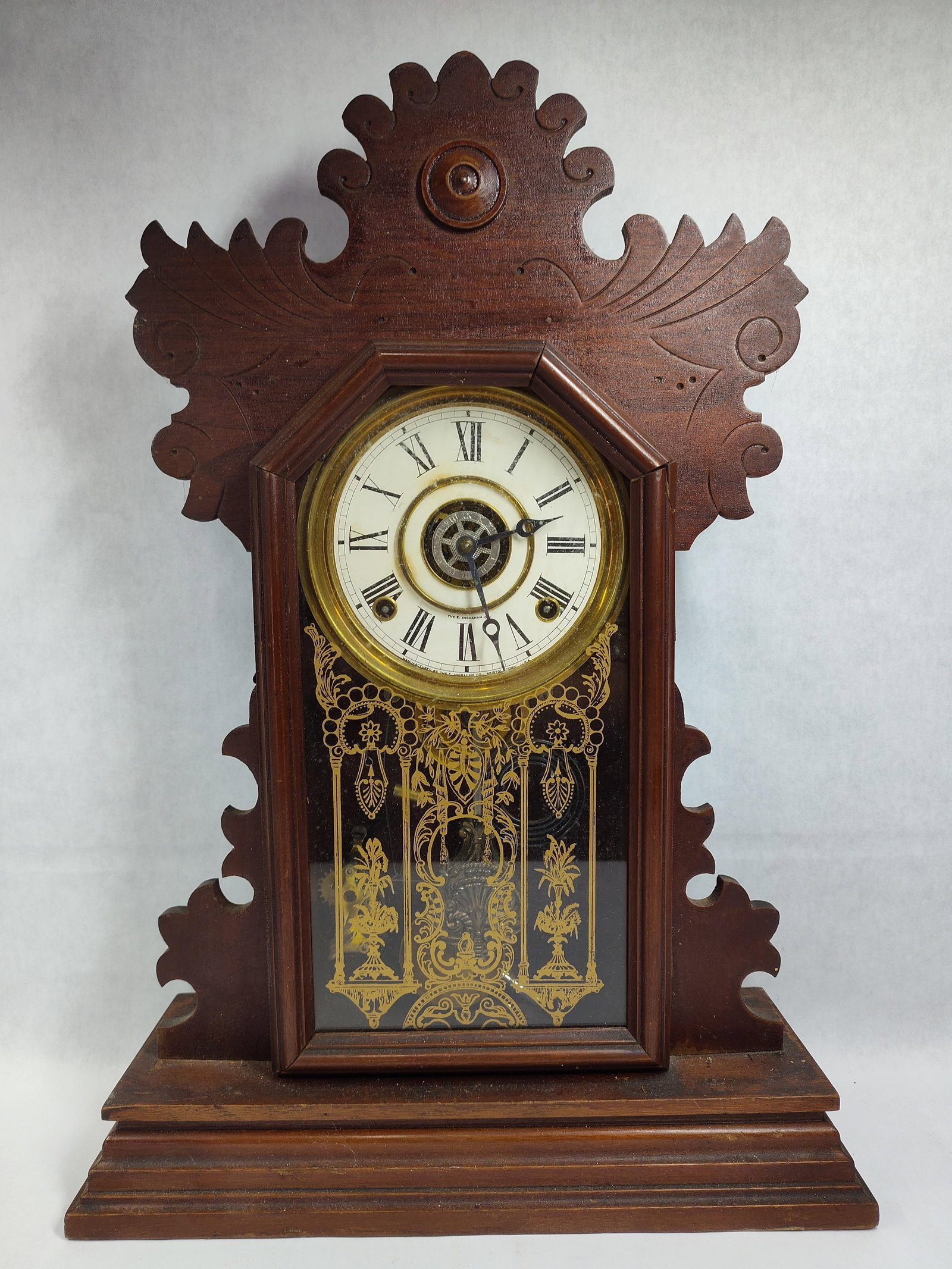 Late 19th C. E. Ingraham Gingerbread Mantel Clock: Good working condition. This late 19th-century mantel clock, often referred to as a kitchen or gingerbread clock, was manufactured by the E. Ingraham Company in Bristol, Connecticut. The case is