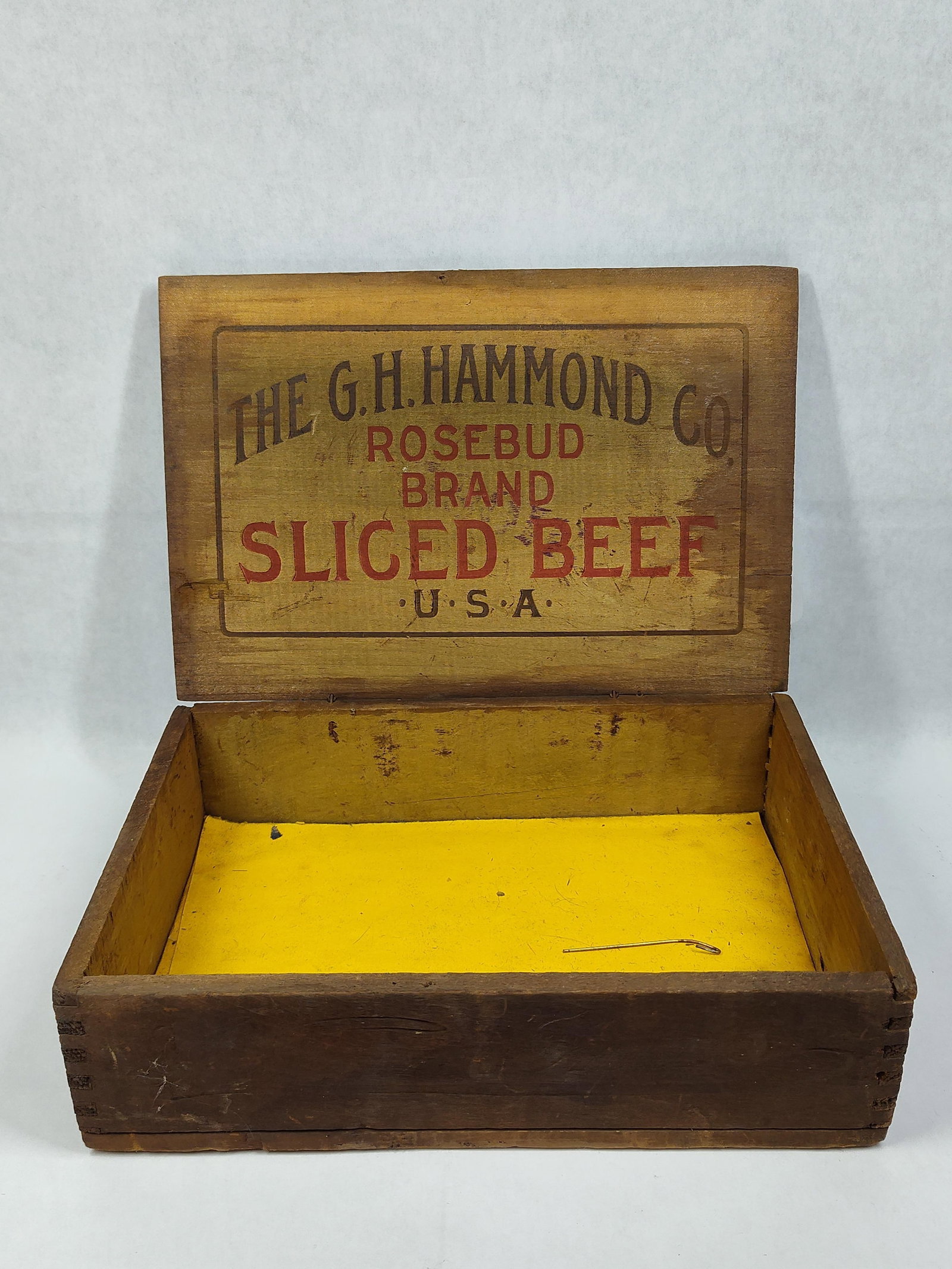 G.H. Hammond Co. Rosebud Sliced Beef Wooden Box: This antique wooden advertising box was produced for the Rosebud Brand Sliced Beef by The G.H. Hammond Co., a prominent American meatpacking firm. The rectangular crate is constructed of wood with