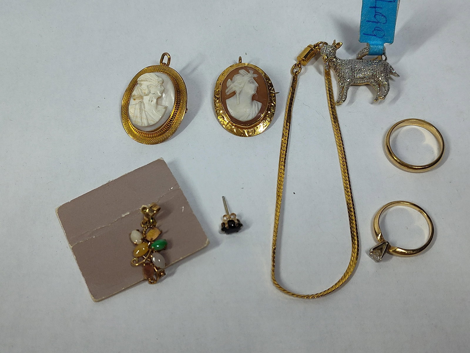 10K & 14K Gold & Gemstone Jewelry Assortment: This group of jewelry consists of several pieces in 10 karat and 14 karat yellow gold featuring shell cameos, jadeite, and diamonds. Included is an oval 14 karat yellow gold shell cameo