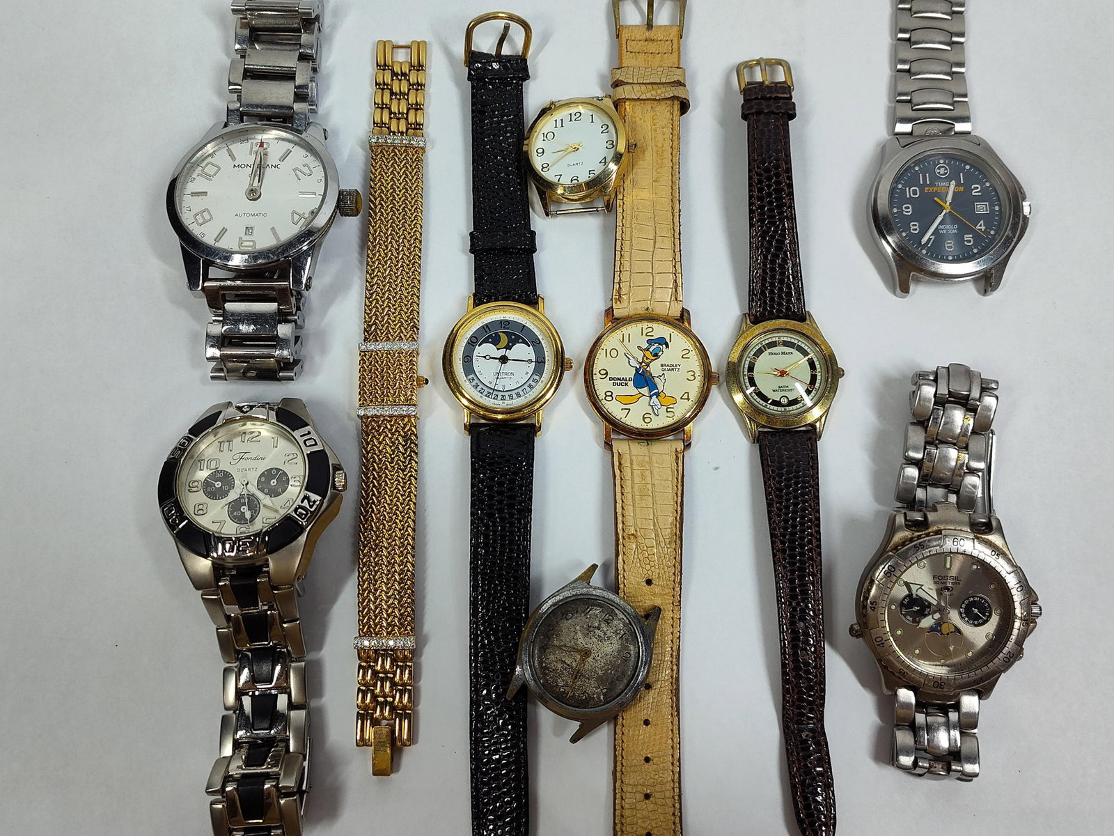 Timex, Fossil & Bradley Watches & Heads, Set 10: This lot comprises ten timepieces including eight wristwatches and two watch heads in various styles. The collection includes a Timex Expedition Indiglo quartz watch with a navy blue dial, Arabic