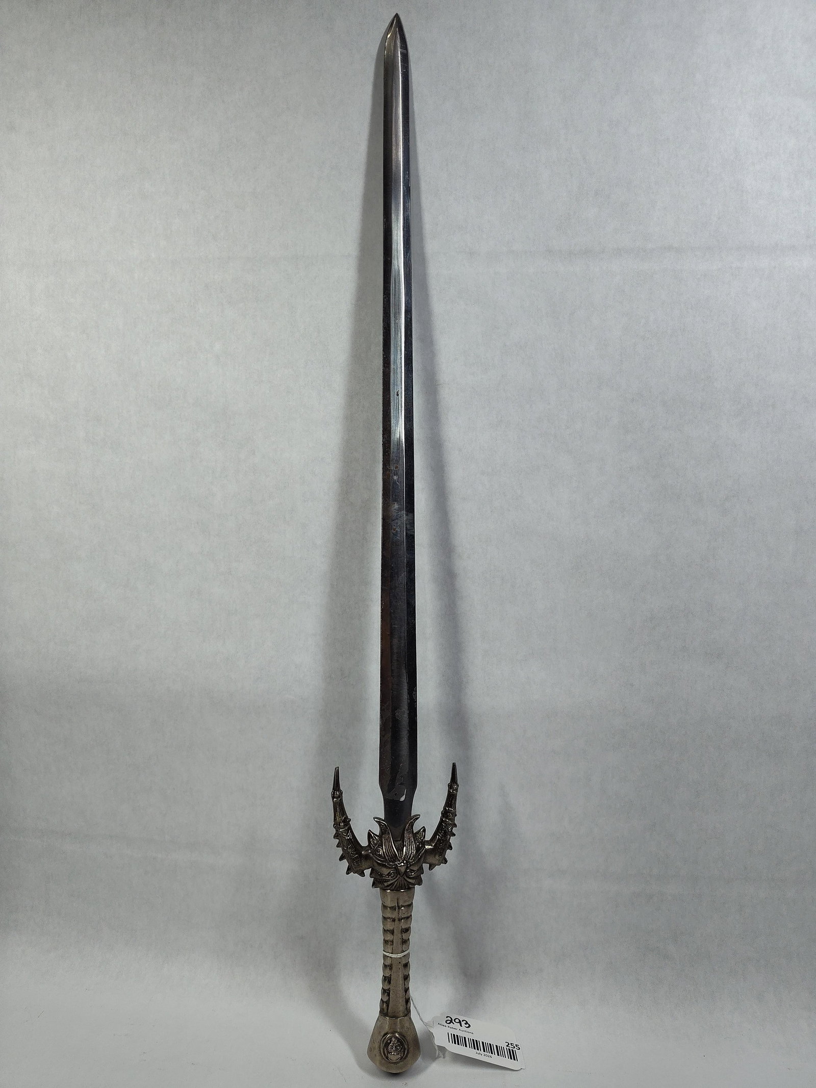 Fantasy Demon Sword w/ Cast Metal Hilt: A contemporary decorative fantasy sword featuring a straight, double-edged polished steel blade. The blade is designed with a central fuller extending approximately two-thirds of its length and