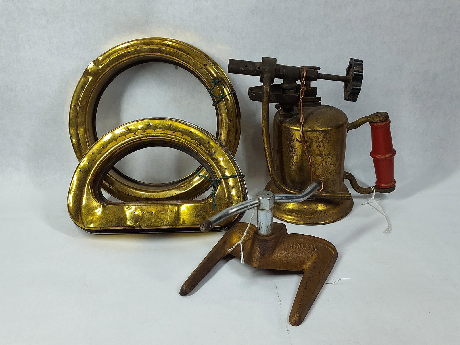 Blow Torch, Sprinklers, and More: This group features an antique gasoline blowtorch and an assortment of garden sprinklers manufactured in Illinois. The handheld gasoline blowtorch was produced by the Turner Brass Works in Sycamore,