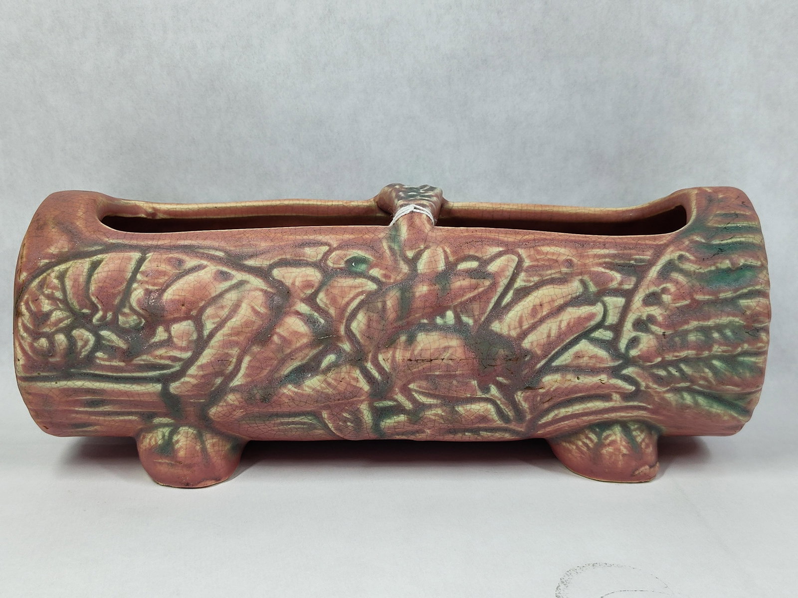 Weller Woodcraft Style Oak Leaf Log Planter: This ceramic log-form trough planter is designed in the Woodcraft style, strongly attributed to Weller Pottery based on the relief-molded patterns and form. The horizontal vessel is molded to