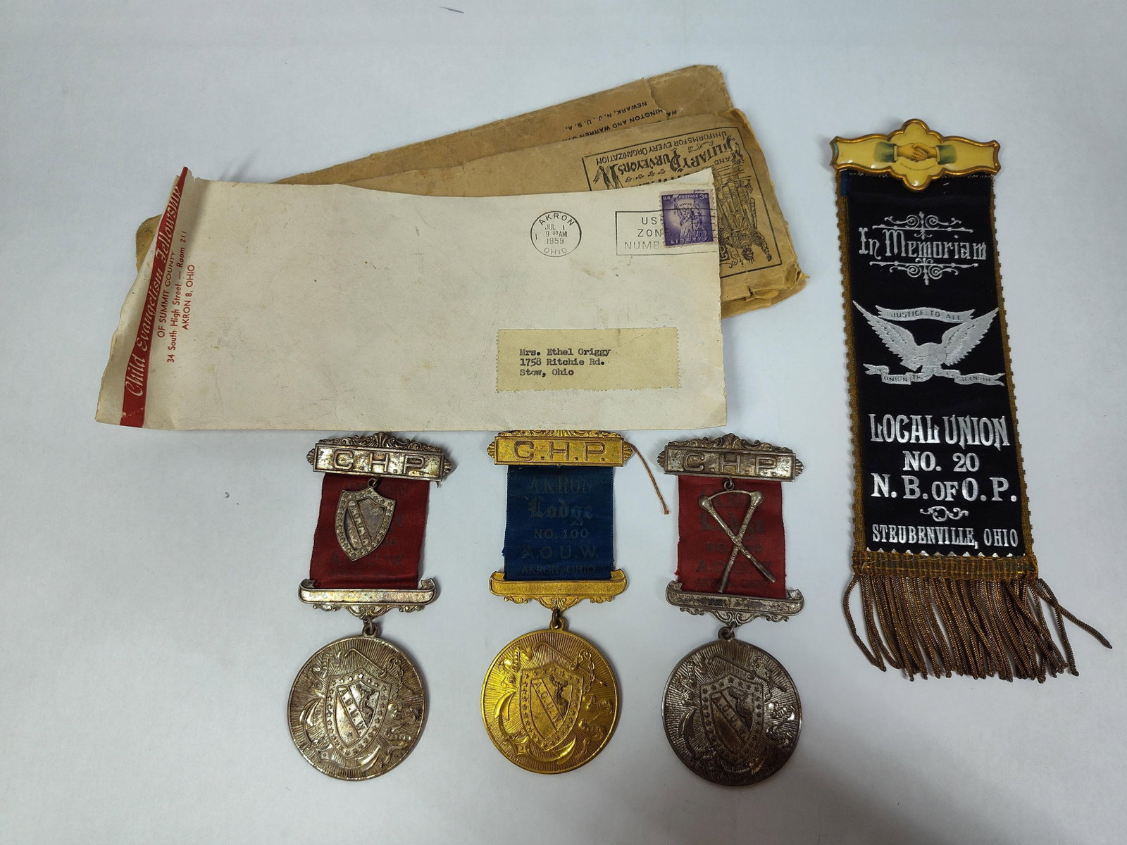 Ohio Fraternal & Labor Union Memorabilia, AOUW: An archive of fraternal and labor union memorabilia primarily focused on Northern Ohio organizations, dating from the late 19th to mid-20th centuries. The collection includes membership badges for