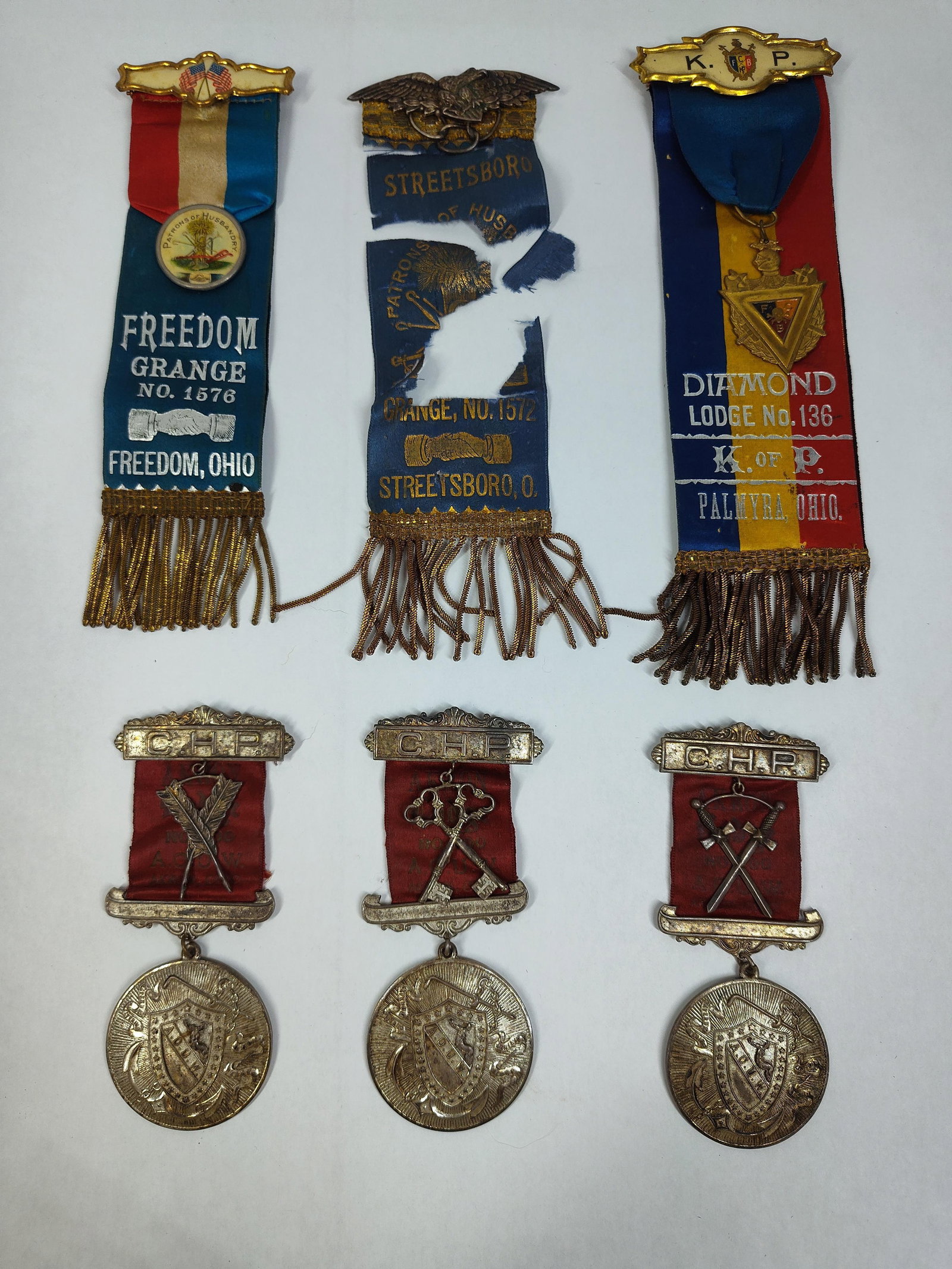 Set 6 Ohio Fraternal Ribbon Badges & Medals: This lot consists of six fraternal organization items primarily from Northeast Ohio, dating to the late 19th and early 20th centuries. The collection represents the Patrons of Husbandry (The Grange),