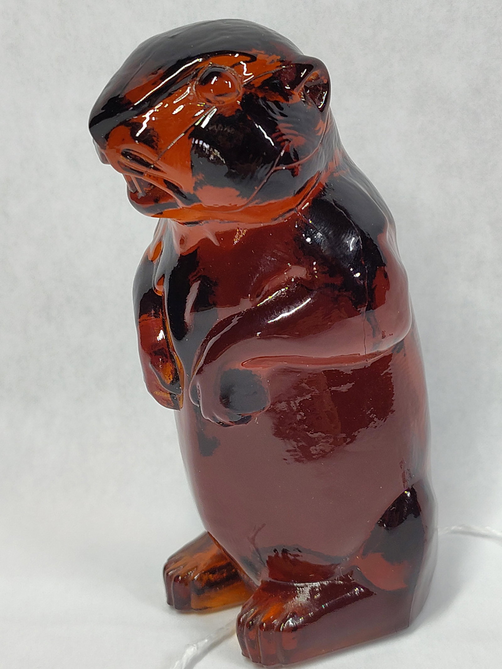 Boyd or Imperial Slag Glass Groundhog Figurine: This slag glass figurine depicts a standing groundhog, also commonly identified as a woodchuck. Based on its form and material, the piece is attributed to American glass manufacturers such as Boyd