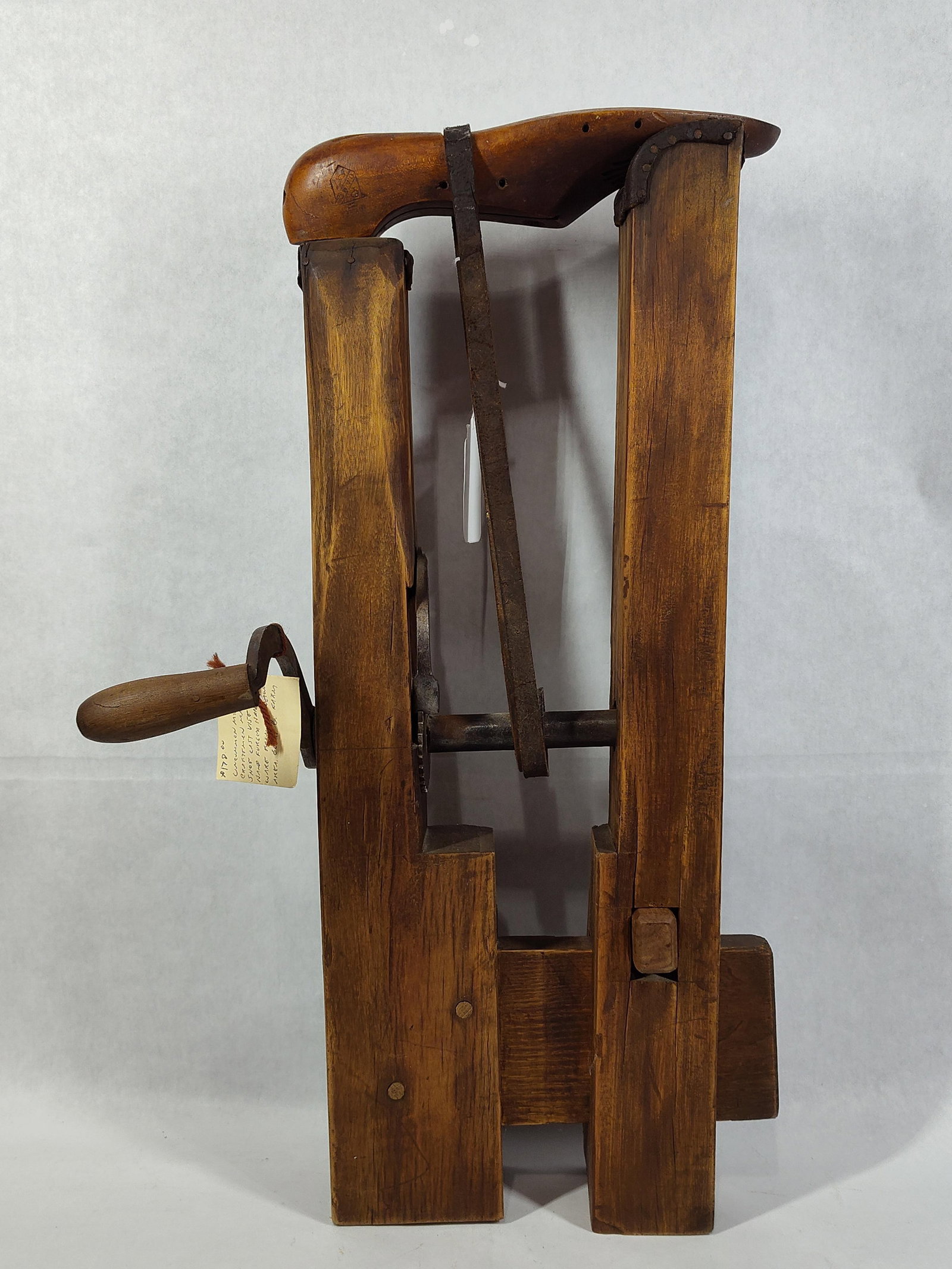 S. M. Co. Industrial Boot & Shoe Vamp Stretcher: This antique industrial tool is a manual boot and shoe vamp stretcher, traditionally used in professional cobbler shops or bootmaking factories. The device is constructed with a heavy wooden frame