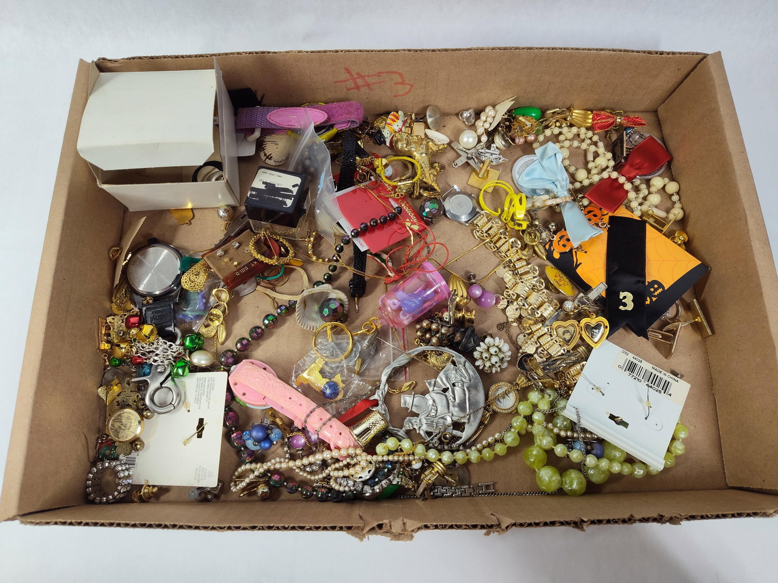 Late 20th C. Costume Jewelry & Accessories: An assortment of costume jewelry and small miscellaneous items primarily dating from the late 20th century. The collection features several wristwatches, including a ladies gold-tone LA Gear fashion