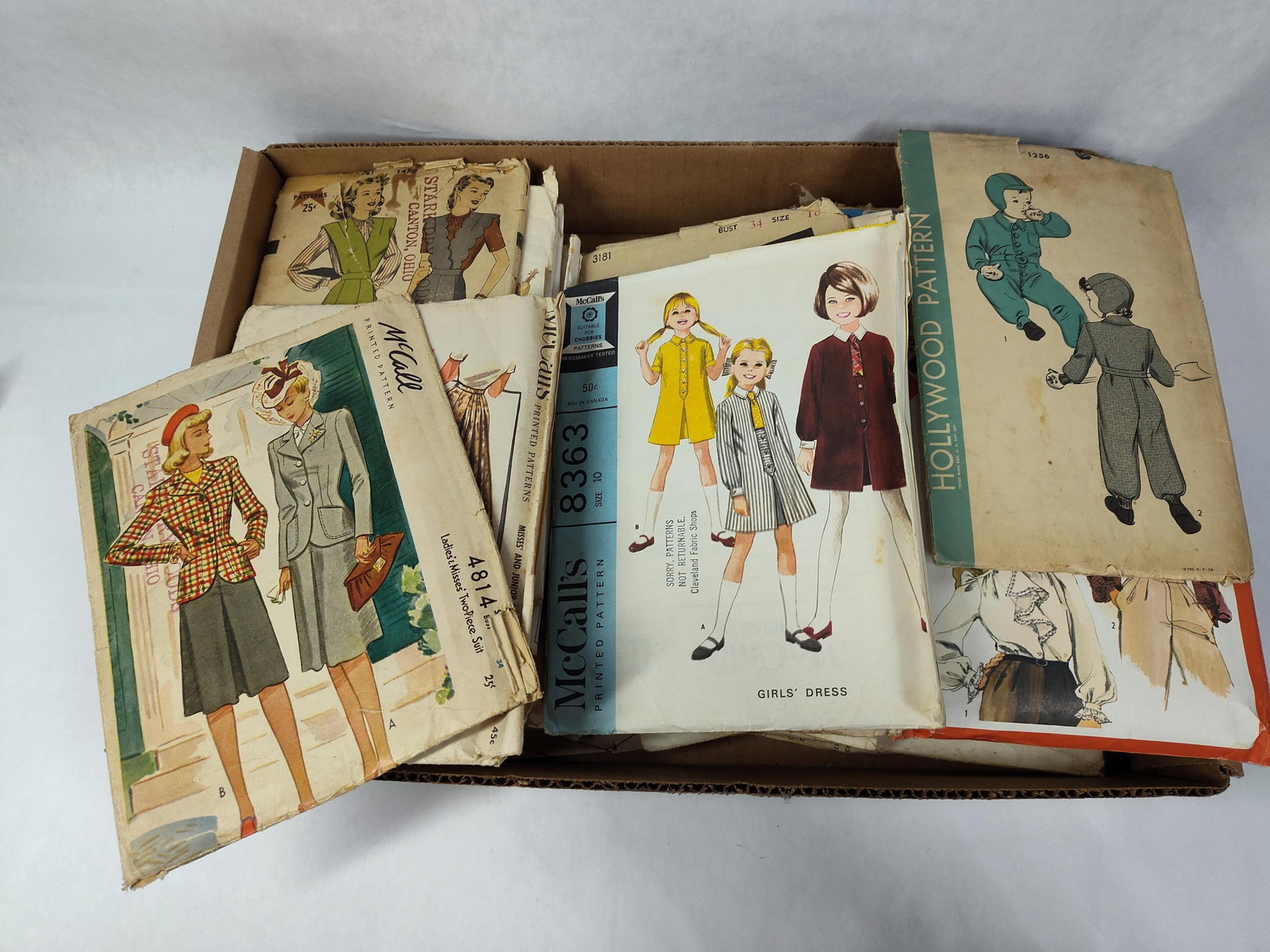 Collection Sewing Patterns, mid-20th C: This collection of paper sewing patterns dates primarily from the 1940s through the 1960s. The lot includes various designs for women's, girls', and infants' apparel from several major American