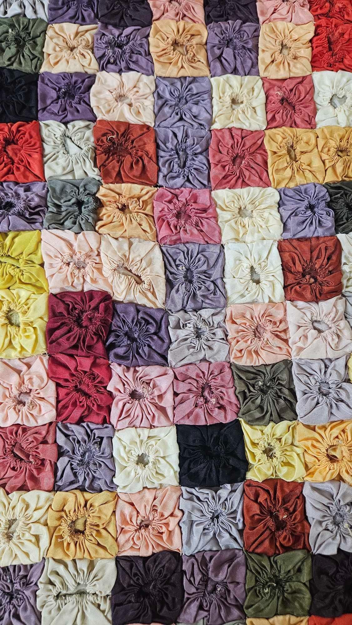 American Silk & Satin Yo-Yo Patchwork Quilt: This vintage handmade textile is a square yo-yo quilt, a variation of the traditional circular yo-yo motif popular in the early to mid-20th century. The piece is constructed from individual square-sha