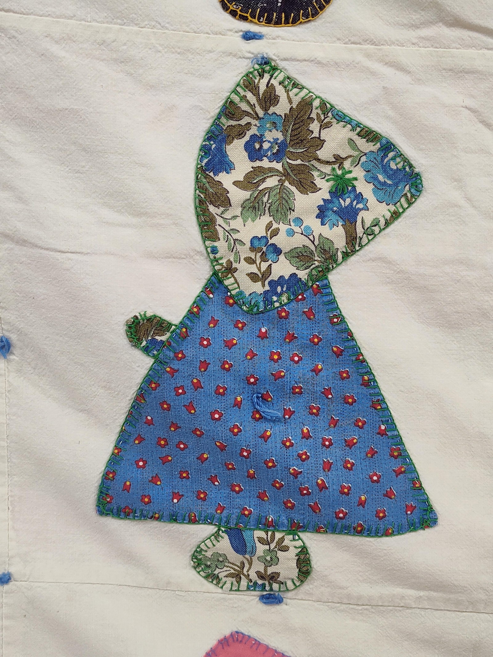 Hand-Appliqued Sunbonnet Sue Scrap Quilt: This vintage hand-appliqued scrap quilt features the Sunbonnet Sue pattern, composed of forty-two individual blocks arranged in a six-by-seven grid. Each block depicts a figure of a girl in a bonnet, 