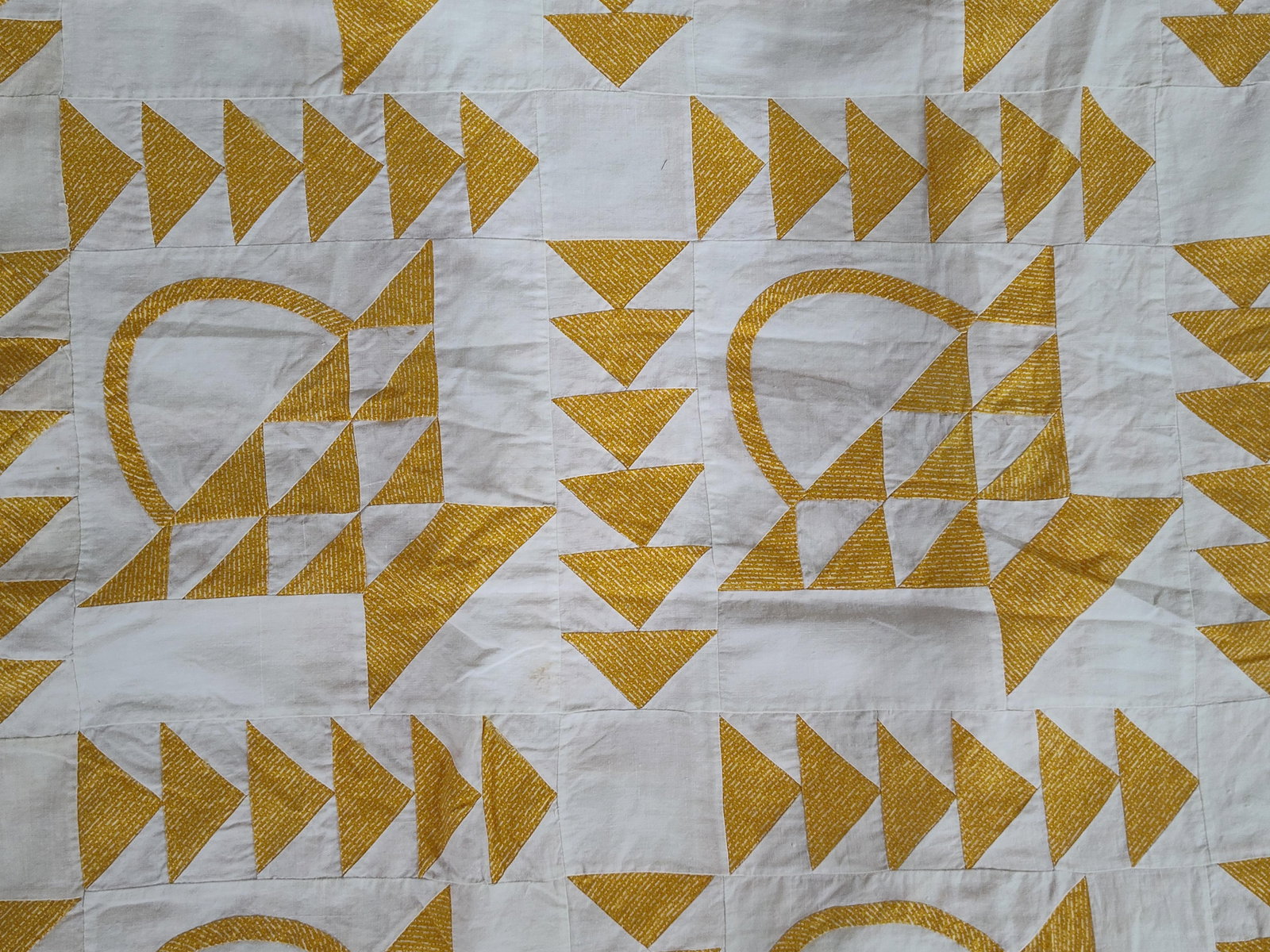 American Cotton Basket & Flying Geese Quilt Top: This is an unfinished American pieced quilt top crafted from cotton fabric. The design consists of a twelve-block grid featuring a traditional basket motif. Each basket is constructed from triangular 