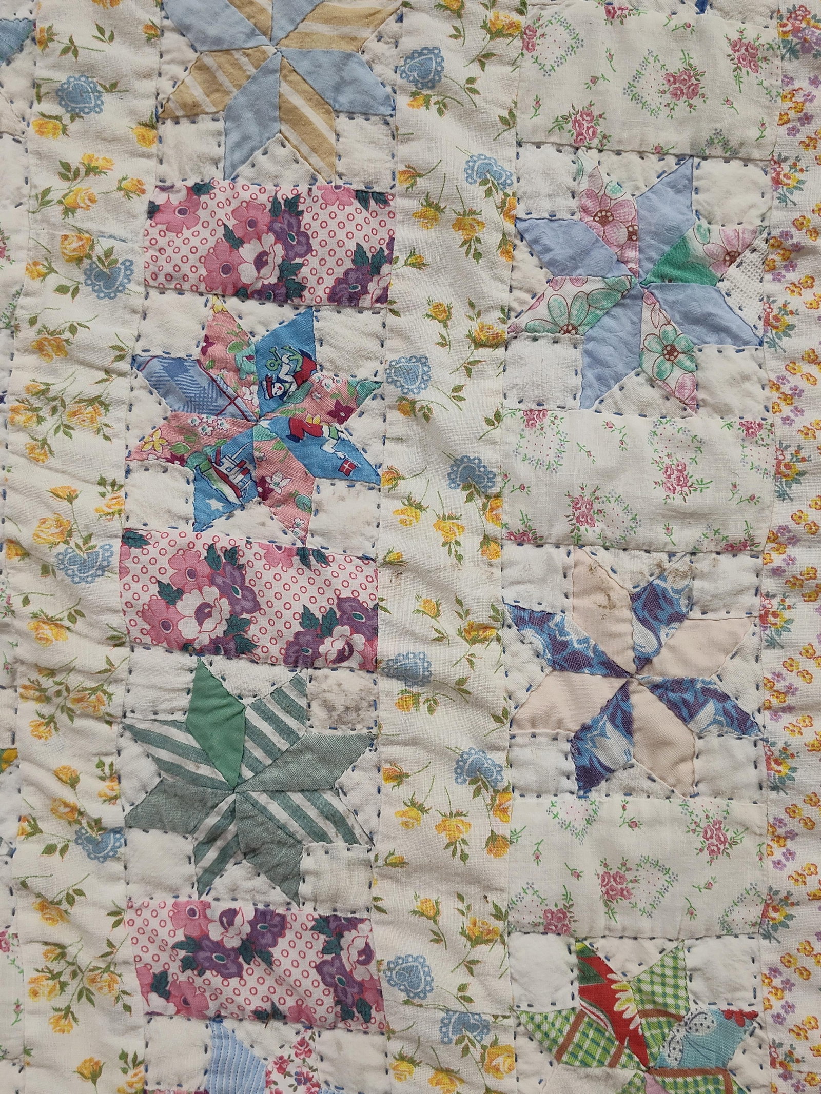 Mid-C. LeMoyne Star Hand-Quilted Scrap Quilt: This vintage scrap quilt features a hand-pieced eight-point star pattern, often identified as a LeMoyne Star or Friendship Star. The quilt is constructed from a wide variety of mid-20th century cotton