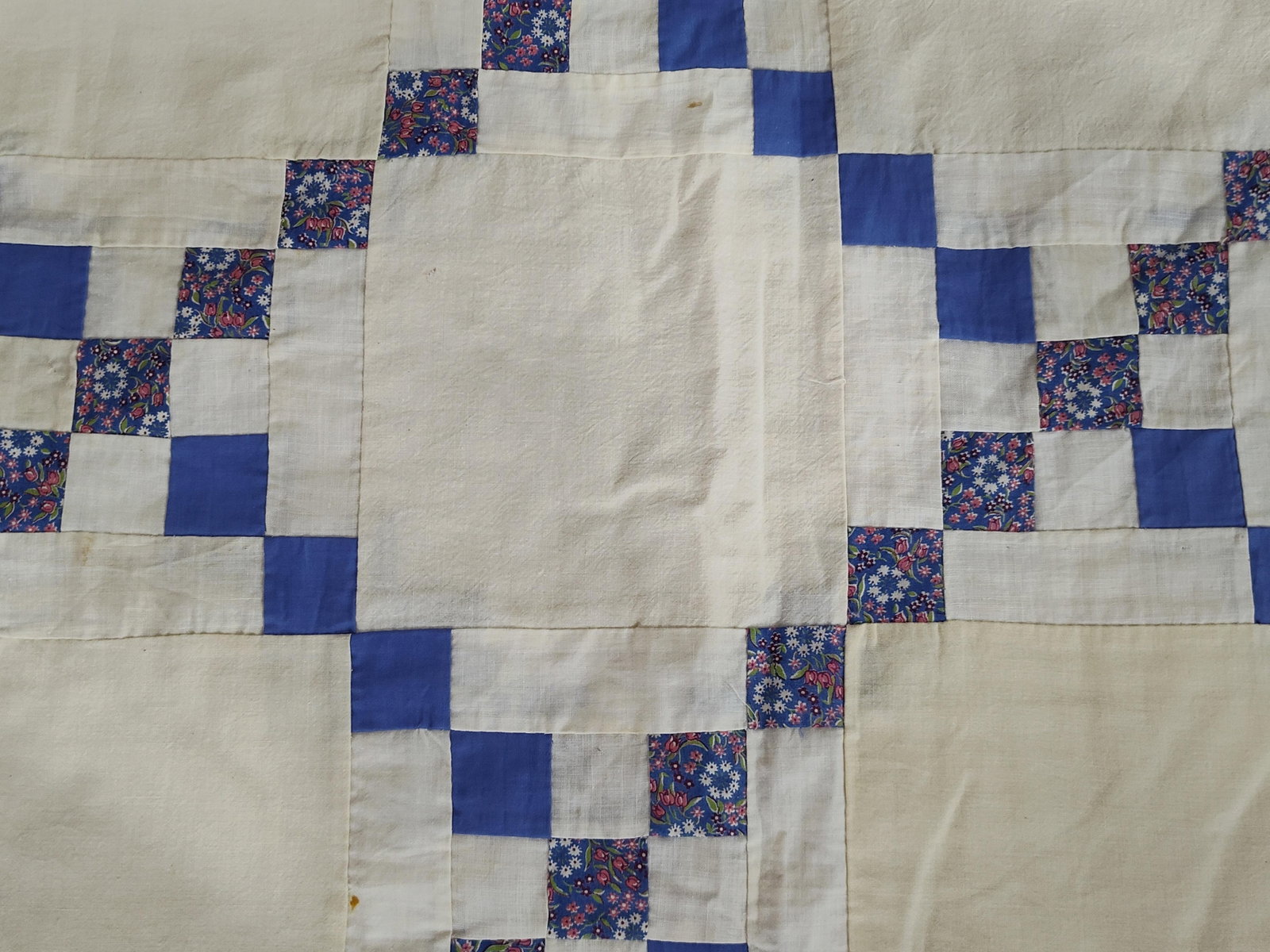 Cotton Double Irish Chain Quilt Top: A mid-20th century American quilt top featuring the Double Irish Chain pattern. The textile is constructed from cotton fabrics, showcasing large off-white or cream blocks alternating with a grid-like 