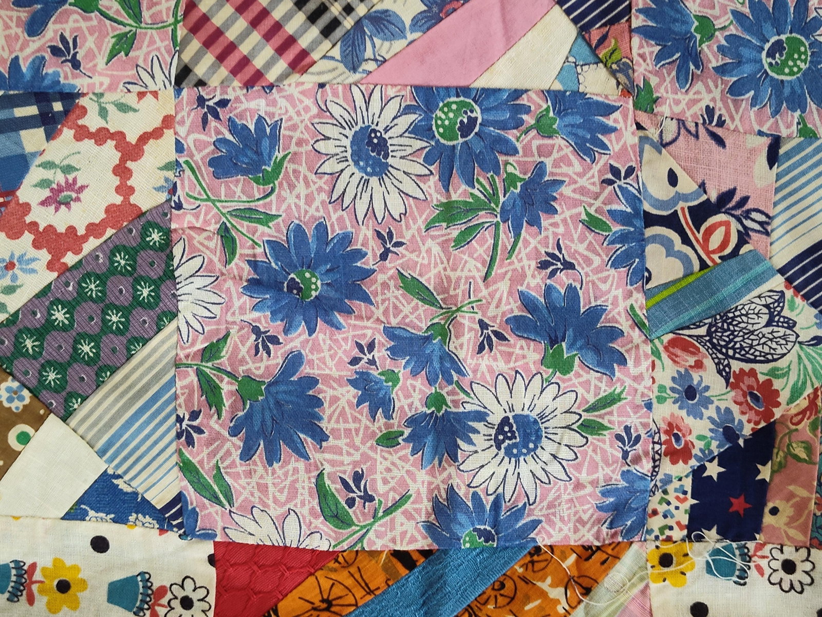 Mid-20th C. Mixed String-Pieced Utility Quilt: A handmade utility quilt constructed in a string-pieced crazy quilt pattern, dating to the mid-to-late 20th century. The design features alternating solid navy blue blocks and multi-colored scrappy