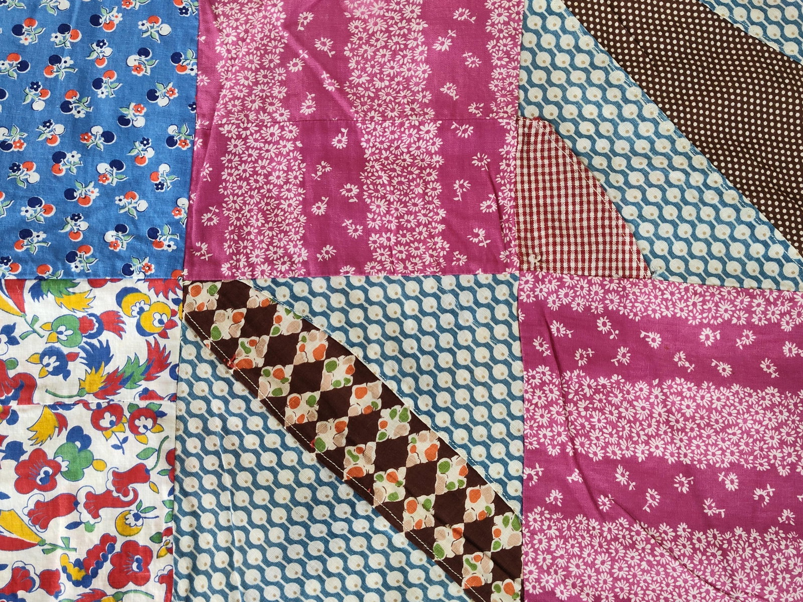 Hand-Sewn Cotton Patchwork Quilt Top, Mid-20th C: A hand-sewn scrap patchwork quilt top constructed from a diverse assortment of cotton print fabrics. This item consists of the pieced decorative layer only and has not been finished with batting or ba