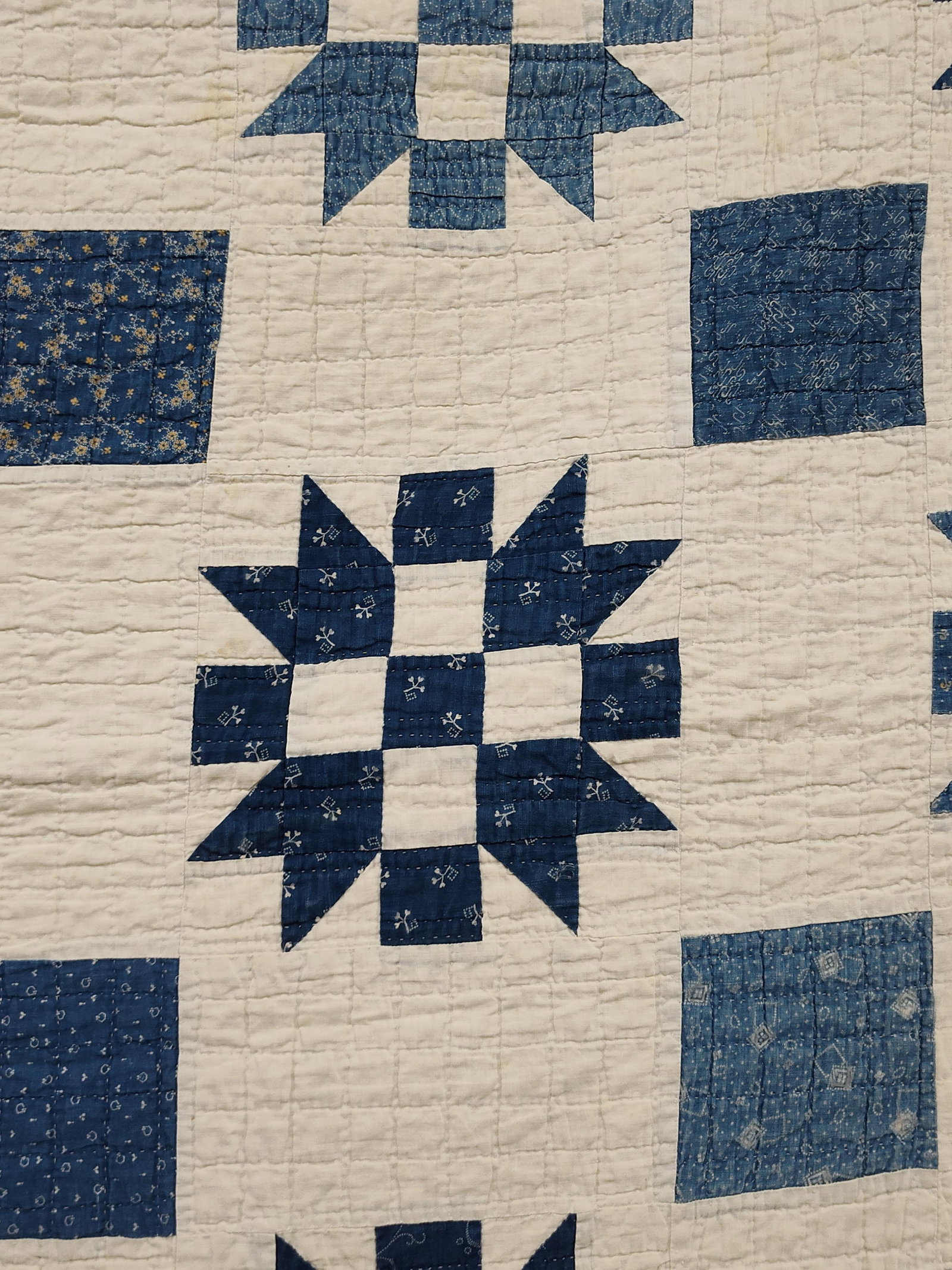 Antique American Indigo & White Shoo-Fly Quilt: This is an antique American hand-pieced and hand-quilted cotton quilt, likely dating from the late 19th to early 20th century. The piece features a grid of Shoo-Fly pattern blocks (a variation featuri