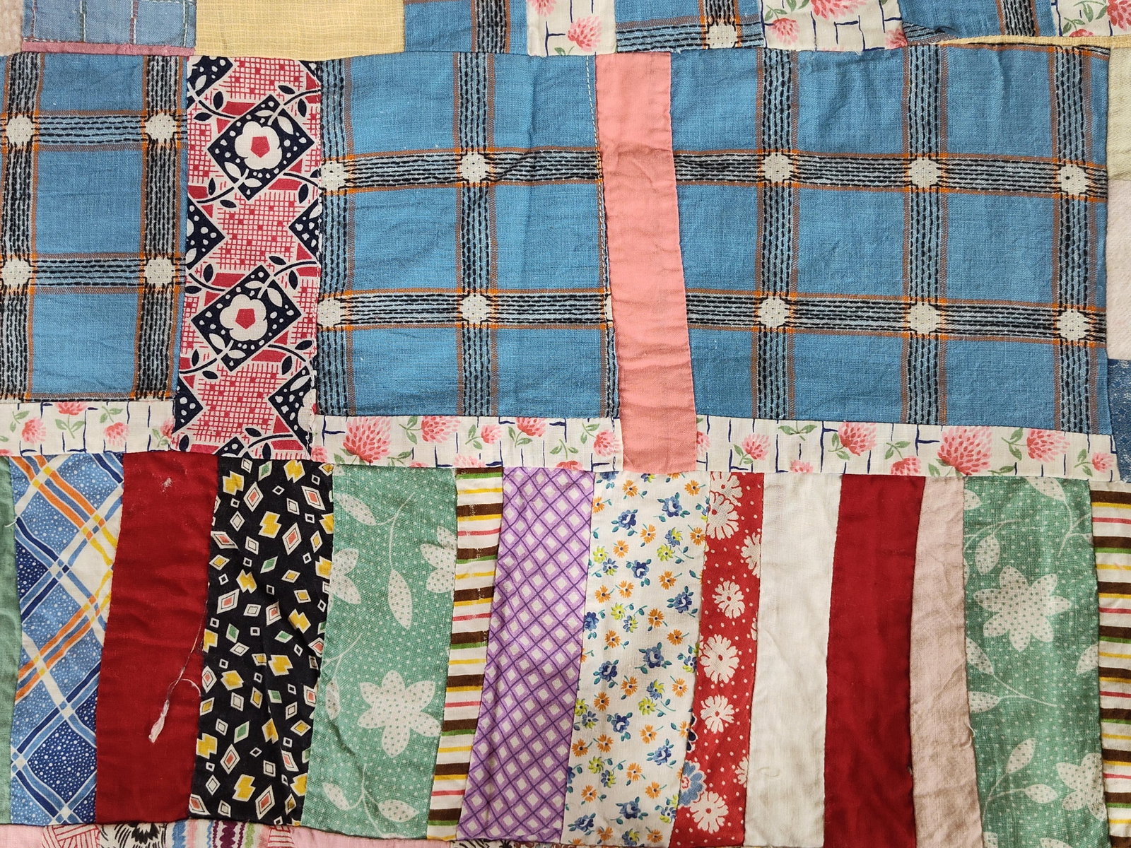 Mid-20th C. American Strip-Pieced Quilt Top: This is a mid-20th-century American scrap quilt top featuring a string or strip-pieced patchwork design. The construction utilizes a wide variety of fabric remnants, including printed cotton calicos,