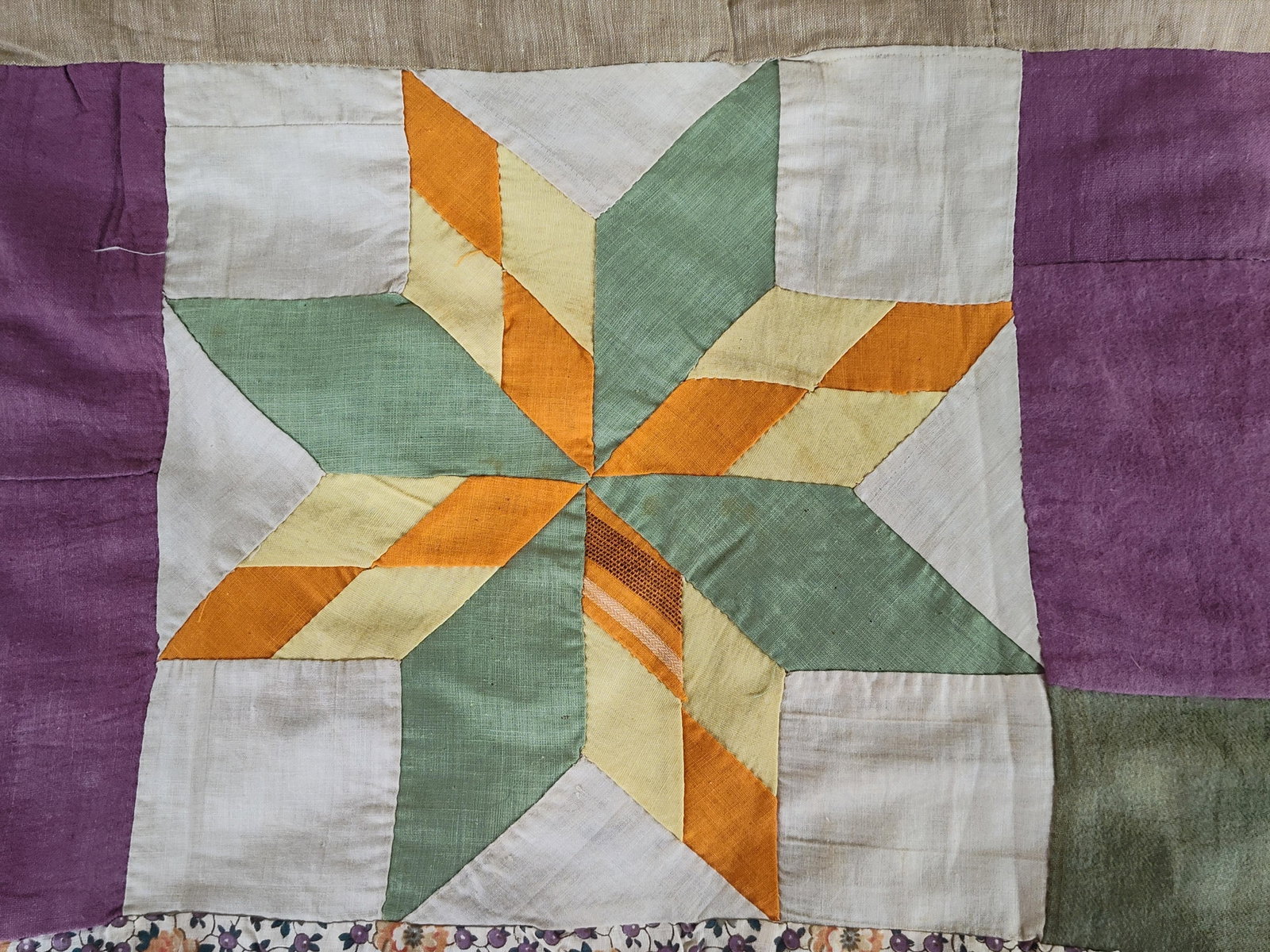 American Eight-Point Star Sampler Quilt Top: A mid-20th century American sampler quilt top, hand-pieced from an assortment of scrap fabrics. The construction includes cotton and cotton-blend calicos, ginghams, solids, and prints resembling mid-c