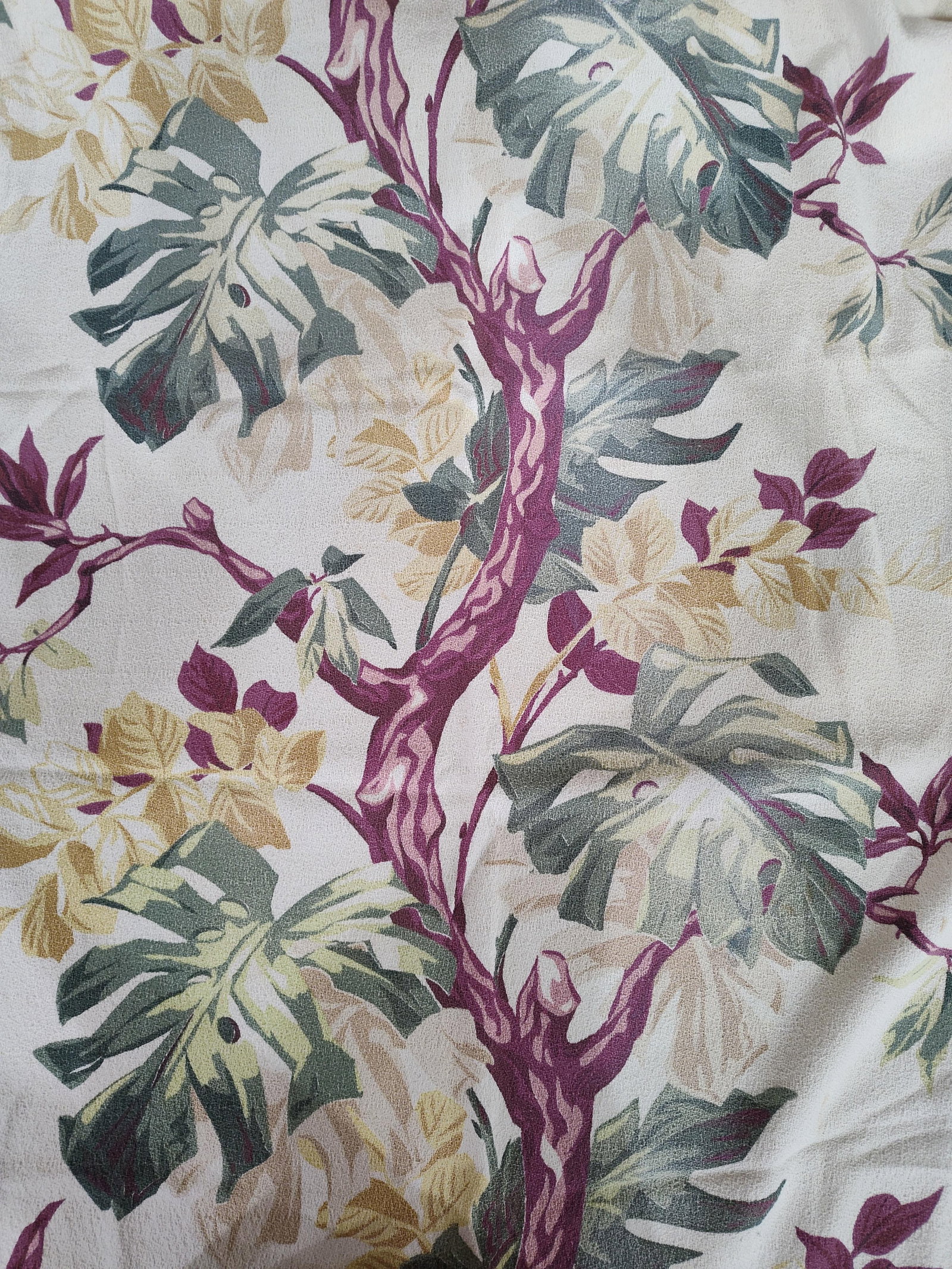 Pair Tropical Botanical Print Curtain Panels: This lot consists of a pair of vintage curtain panels. The pieces are constructed from a heavyweight textured fabric with a pebbled, barkcloth-style weave, likely a cotton or cotton-synthetic blend. T