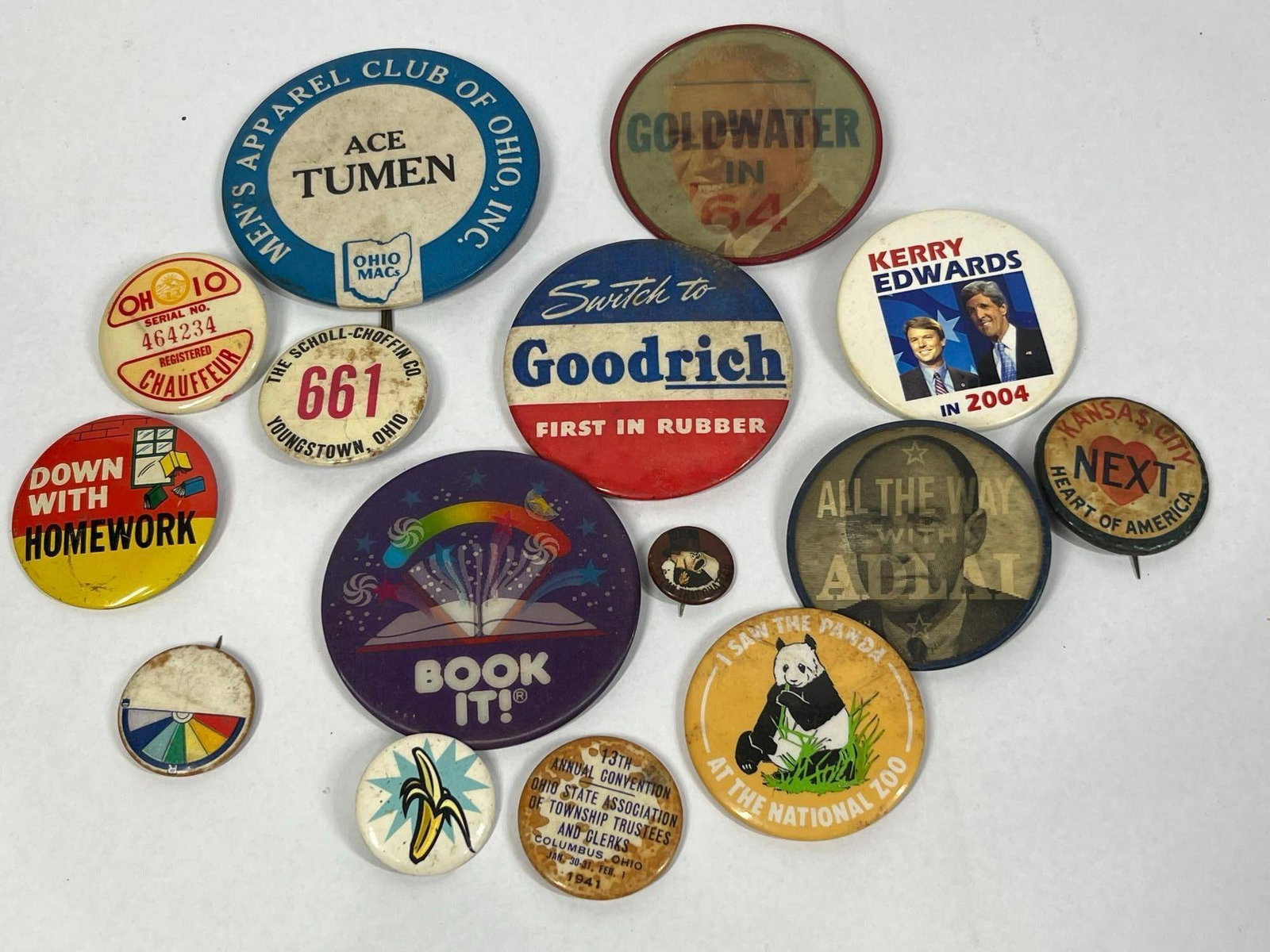 14 Political & Flicker Pinbacks: An assortment of 14 vintage pins and pinback buttons produced between 1941 and 2004. The collection features political campaign materials, regional Ohio history items, commercial advertising, and nove