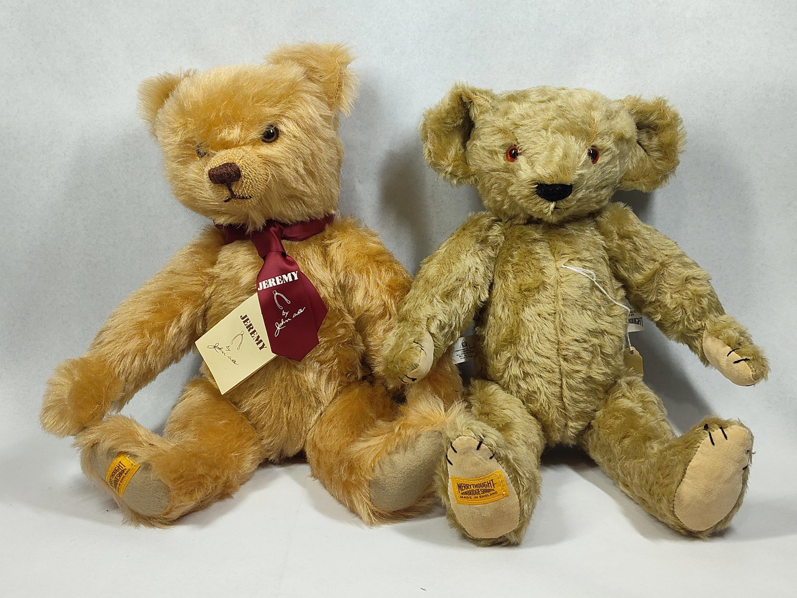 Pair Merrythought John Axe Mohair Bears: 17in tall This lot features two jointed teddy bears handcrafted by Merrythought in Ironbridge, Shropshire, England. The first bear, titled Jeremy, was designed exclusively for Merrythought by artist a