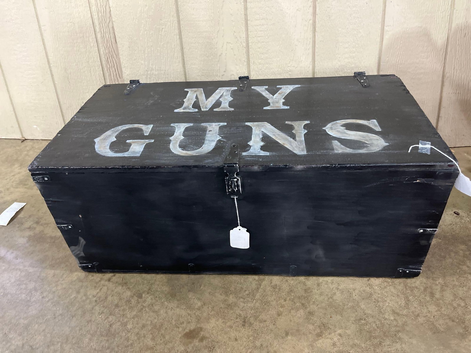 US Military Footlocker w/ Firearms Ads: 32x16x13 This large, black-painted wooden storage chest is designed in the style of a mid-20th century military surplus footlocker. The exterior features a matte finish with the words MY GUNS