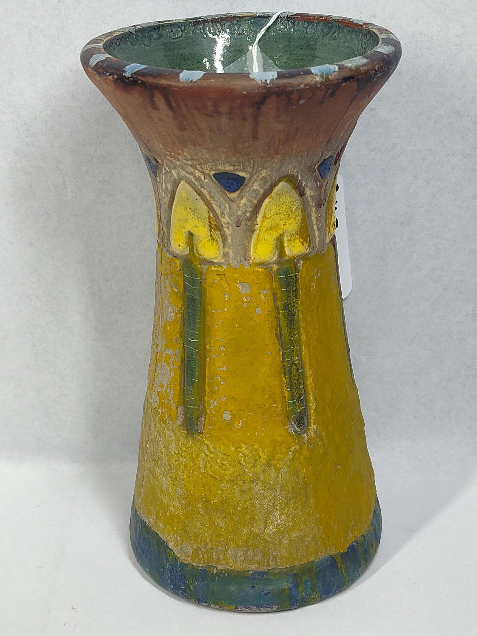 Attributed Roseville Mostique Vase: 8in tall. An American Arts and Crafts style earthenware vase featuring the Mostique pattern, attributed to Roseville Pottery. The vessel is designed in a flared trumpet form with a wide, tapering body