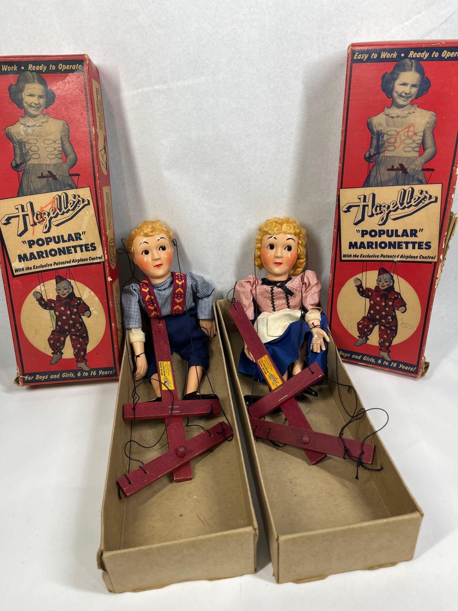 Hazelle Hansel & Gretel Marionettes: This lot features a pair of vintage marionettes from the Hazelle's Popular line, depicting the fairy tale characters No. 813 Hansel and No. 814 Gretel. Produced in Kansas City, Missouri, these puppets