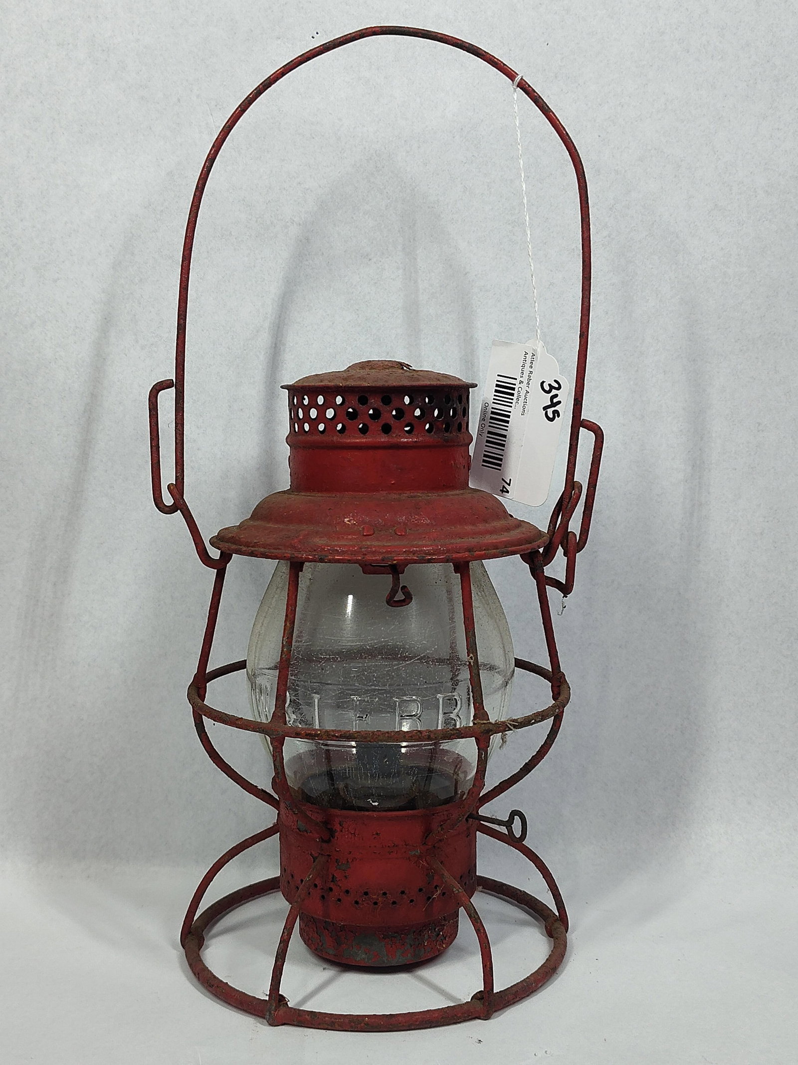 Antique Red Painted Railroad Lantern with W & L E R R Embossed Globe: 10in This antique railroad lantern consists of a metal frame with a red-painted finish and a clear glass globe. The glass globe is embossed with the letters W & L E R R, representing the Wheeling and 