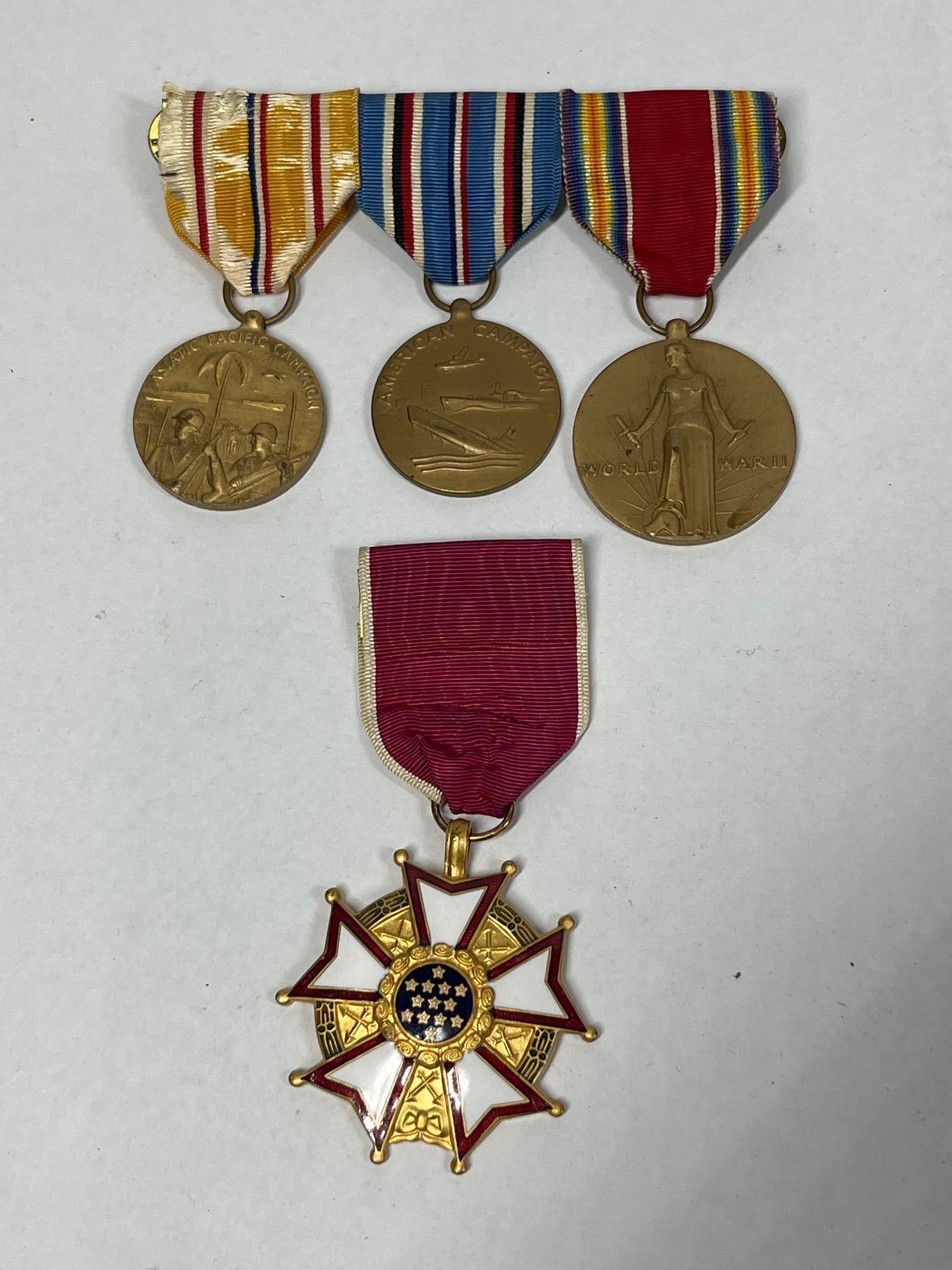 A Group of United States World War II Service Medals Attributed to Colonel Gerald E. Rodehaver: This lot consists of a group of four United States military service medals awarded to Colonel Gerald E. Rodehaver, who served in the U.S. Army Ordnance Department during World War II. The primary