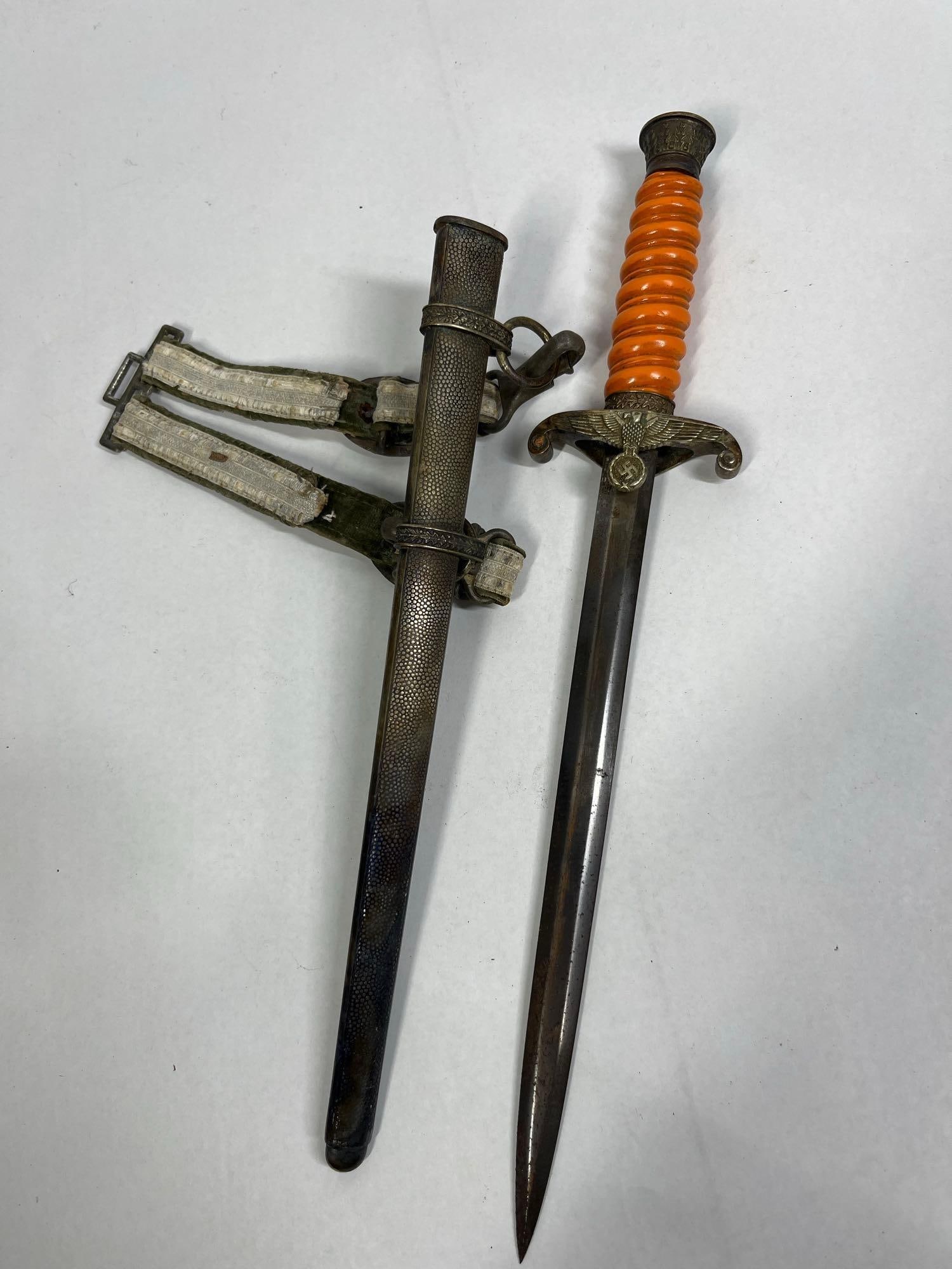 WWII German Army Heer Officer Dagger by Carl Eickhorn: A WWII German Army (Heer) officer's dagger, a sidearm pattern introduced in 1935. The dagger features a tapered, double-edged steel blade. The reverse ricasso is stamped with the manufacturer trad