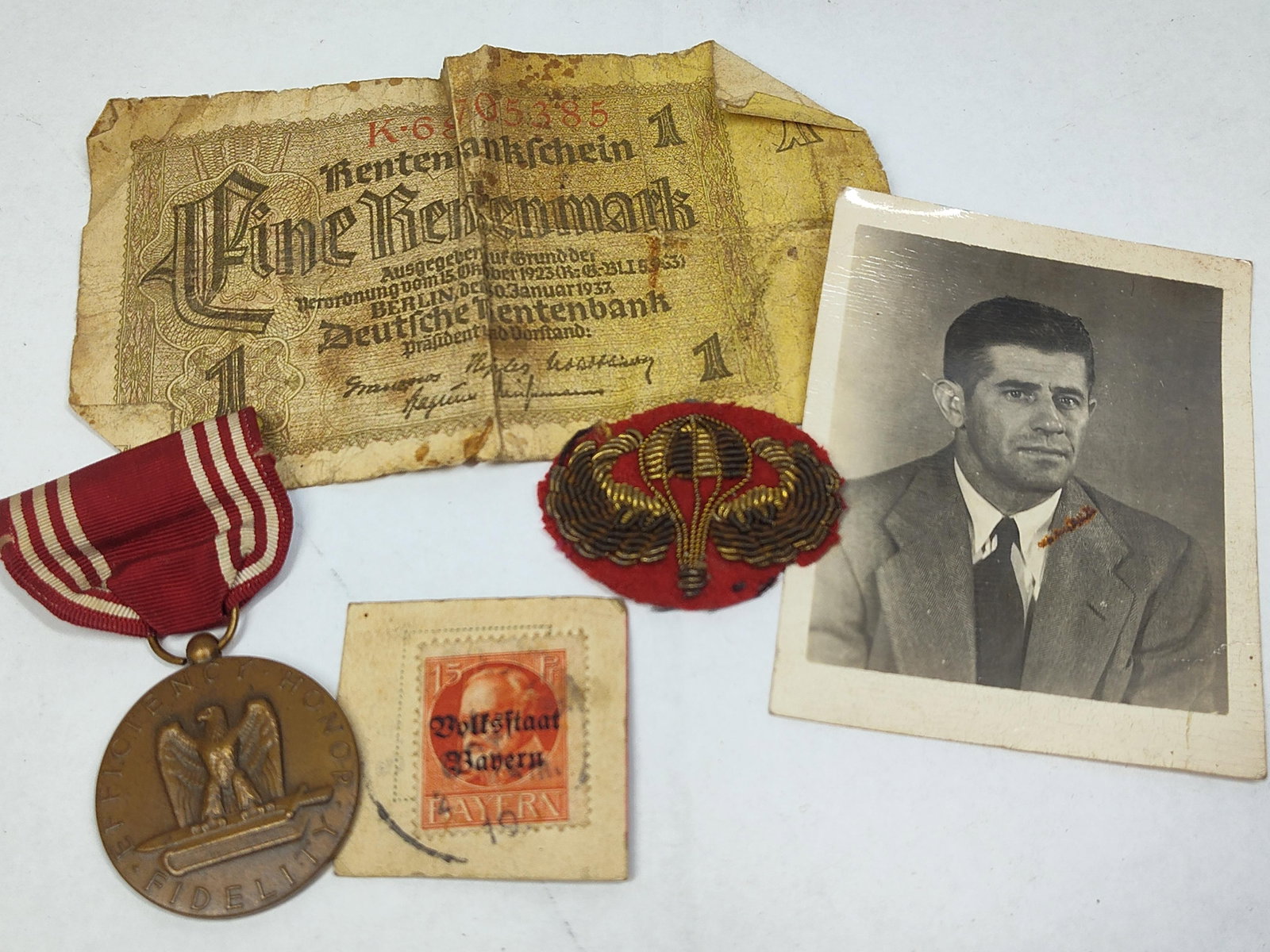 An Assortment of World War II US Army Airborne Insignia, Medal, and European Ephemera (1 of 9)
