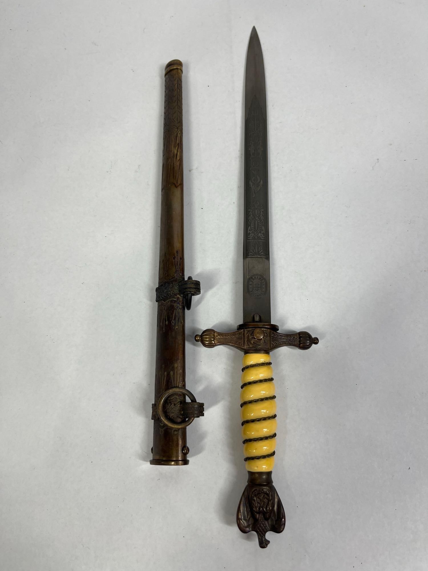 German Third Reich Kriegsmarine M1938 Officer Dagger by E. Bonsmann Solingen: 10in A German Third Reich Kriegsmarine (Navy) Officer Dagger, Model 1938. The double-edged stiletto-style blade features acid-etched naval motifs on both sides, including foliage, tridents, and fouled
