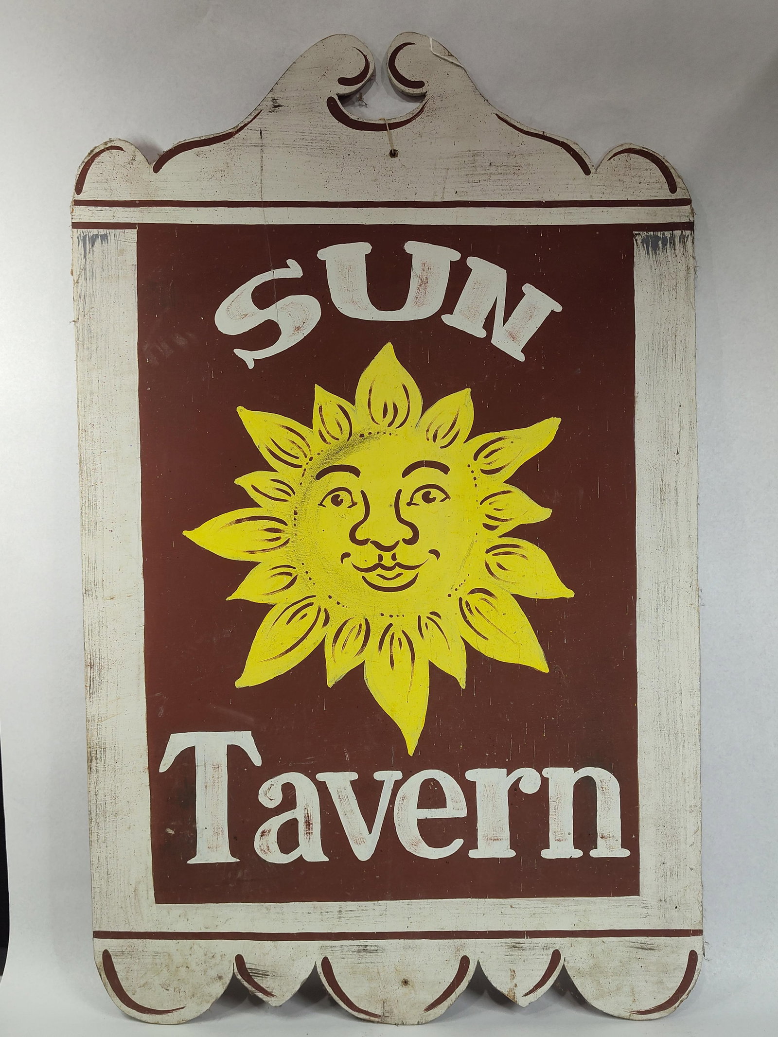 Colonial Revival Sun Tavern Wooden Sign: 24.5x38.5 A decorative wooden sign produced in the American Folk Art tradition, featuring hand-painted elements intended to replicate the appearance of an 18th-century tavern sign. The central