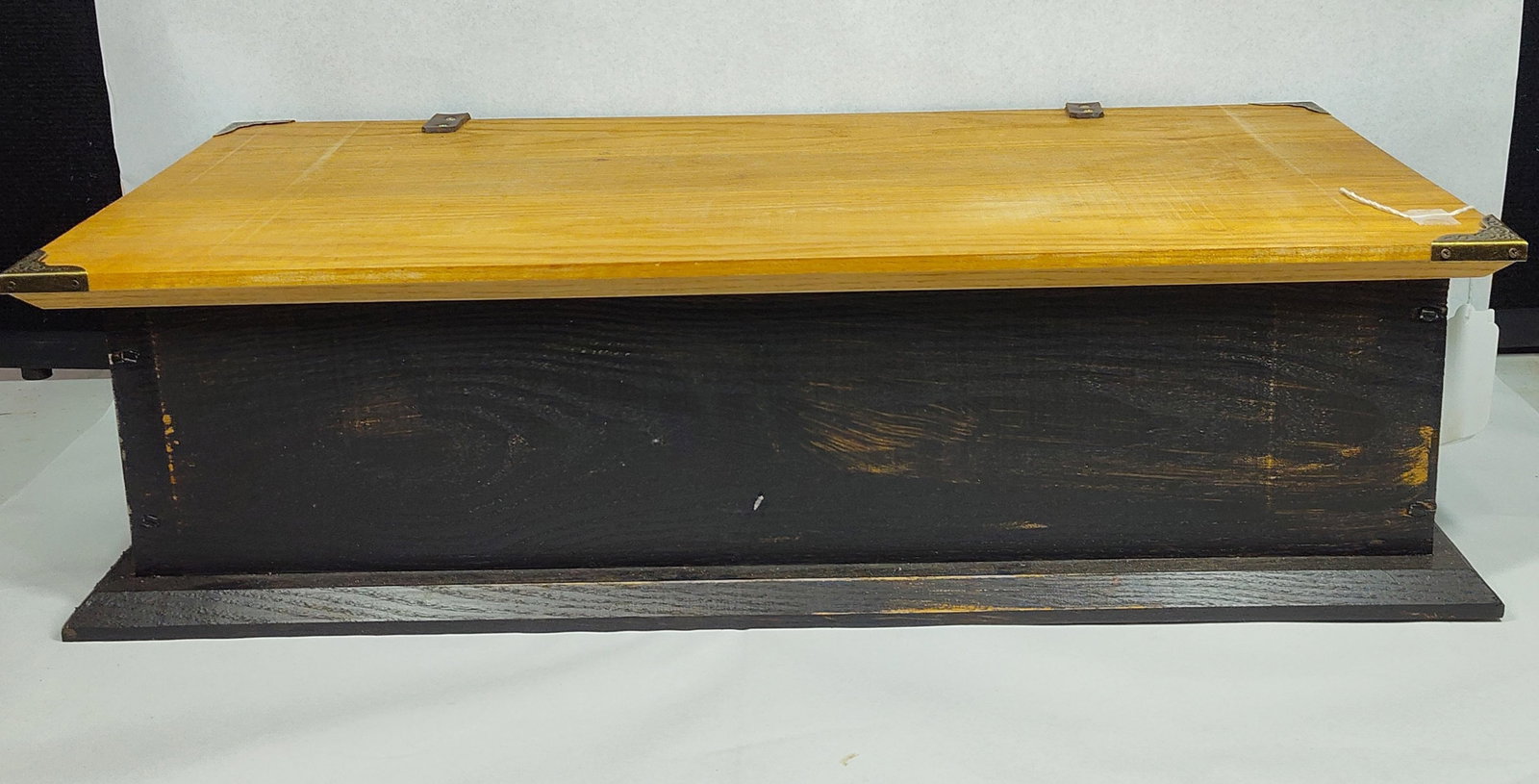 Primitive Two-Tone Wood Chest w/ Metal: 13x26x7 A rectangular wooden storage chest featuring a two-tone finish. The exterior of the main body and the flared base plinth are finished in a dark stain, while the lid and interior exhibit a