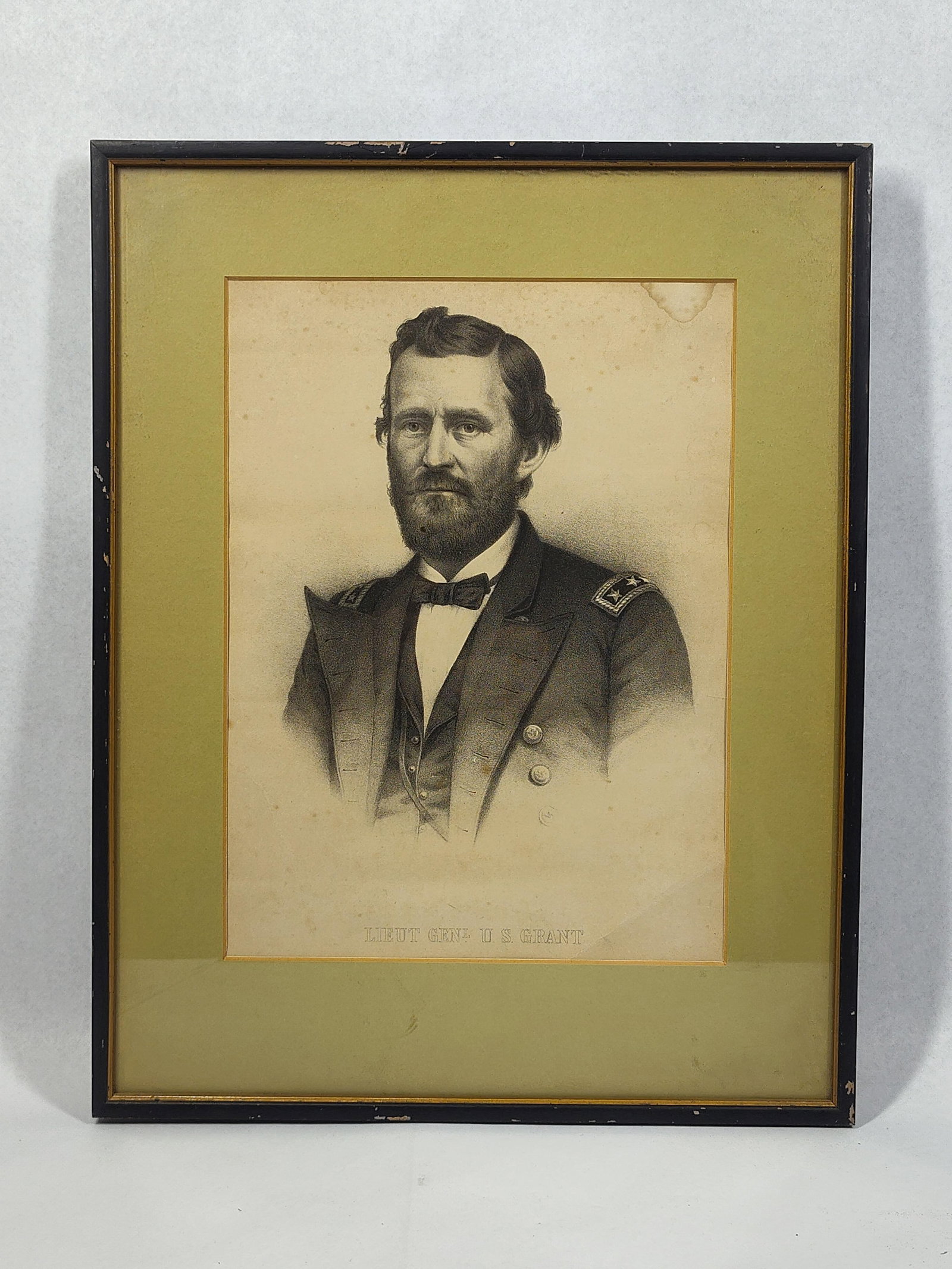 Ulysses S. Grant Mid-19th C. Lithograph: 13x16.5 This mid-19th-century black and white lithograph depicts a bust-length portrait of Ulysses S. Grant in his military uniform. The subject is shown with a full beard and wearing a