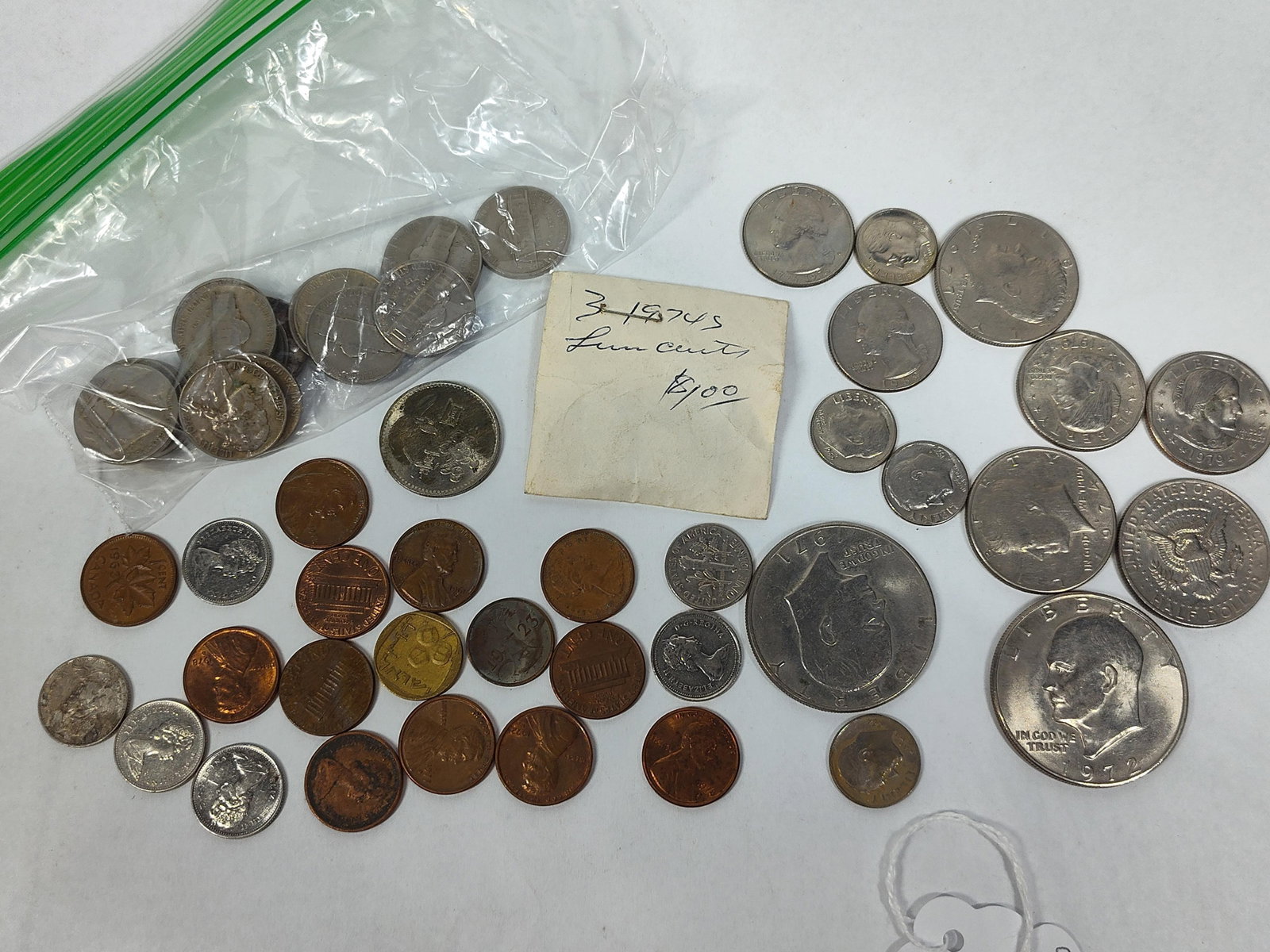 US & World Coins: Eisenhower & Bicent: A collection of circulated coins from the US, Canada, and Israel. The US coinage includes copper-nickel clad Eisenhower dollars dated 1971 and 1972, Susan B. Anthony dollars dated 1979, Kennedy half
