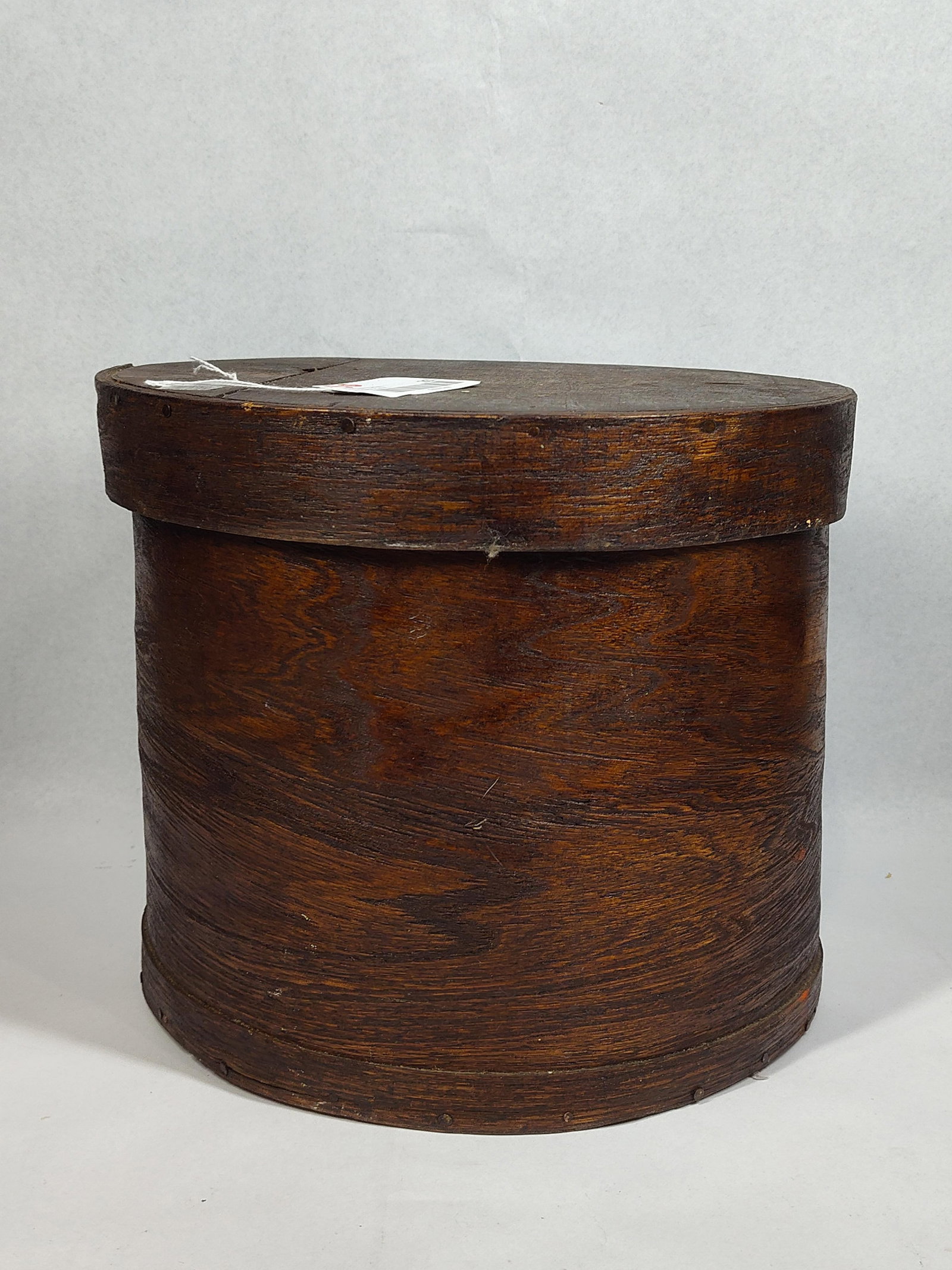 Antique American Bentwood Pantry Box: 10x11.5 An antique large circular bentwood pantry or cheese box, constructed from thin wood with a dark, aged finish. The cylindrical body is formed by a single piece of wood, overlapped at the seam