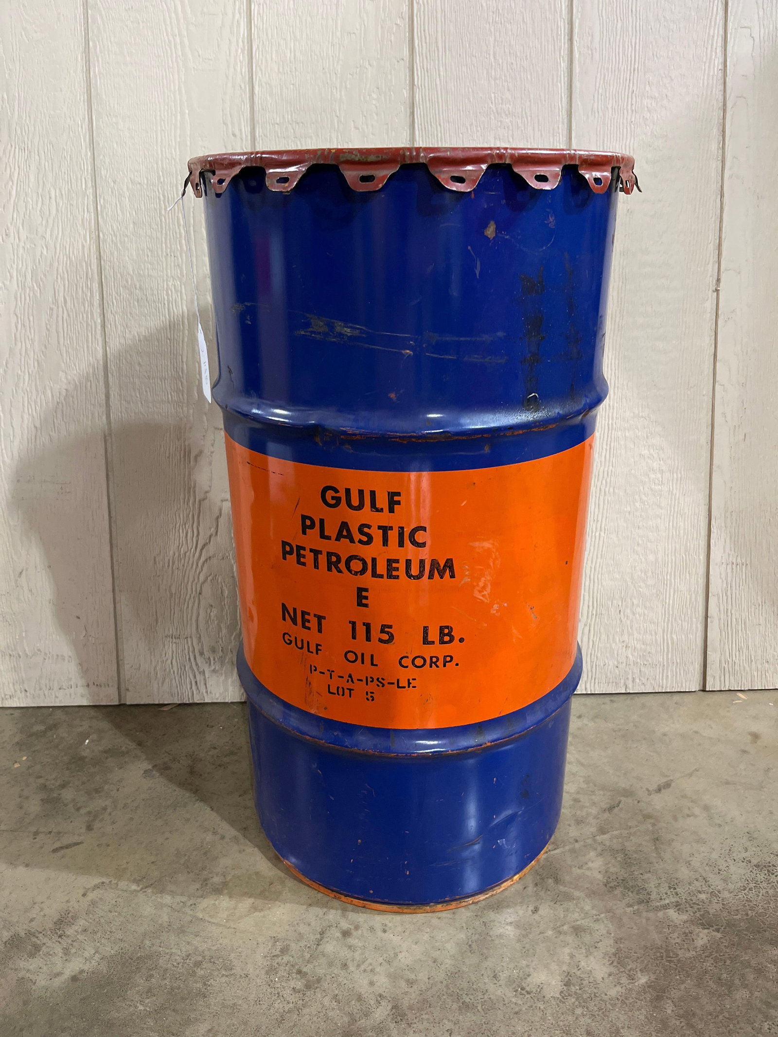 Gulf Oil Corp. Plastic Petroleum Drum: A mid-20th-century industrial product drum produced for the Gulf Oil Corporation. The barrel is constructed of painted steel with a three-rib body design. It features the signature Gulf color