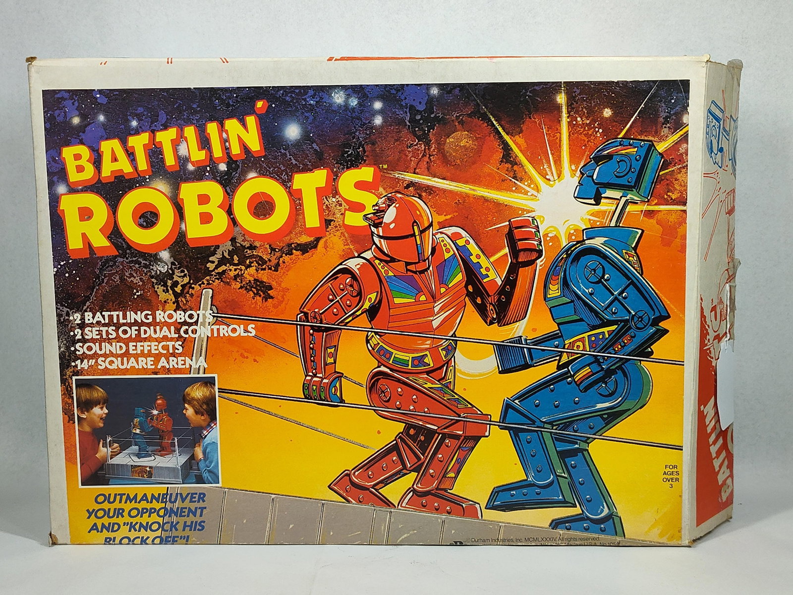 1984 Durham Industries Battlin' Robots Game: This is a vintage Battlin' Robots tabletop mechanical boxing game manufactured by Durham Industries, Inc. in 1984. The set includes a molded gray plastic arena base, two plastic fighting robots in