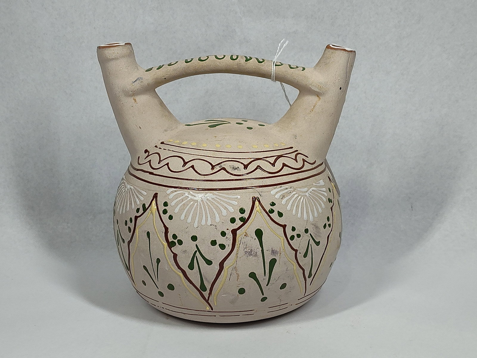 Mexican Barlor Hand-Painted Earthenware Double-Spout Wedding Vase: 8x8 A Mexican earthenware folk art vessel featuring a double-spout and bridge handle form, commonly referred to as a wedding vase. The vessel is constructed with a bulbous body and two tapered spouts