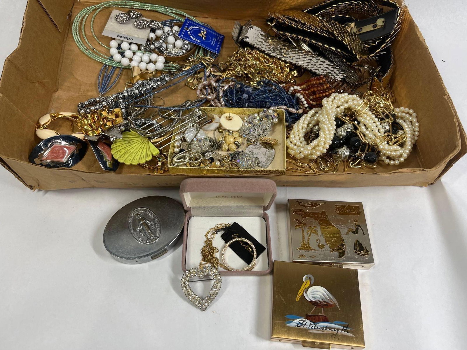 Costume Jewelry & Florida Compacts: This assortment consists of vintage costume jewelry and accessories primarily dating from the mid-to-late 20th century. The collection includes multiple strands of faux pearls, chunky gold-tone chains