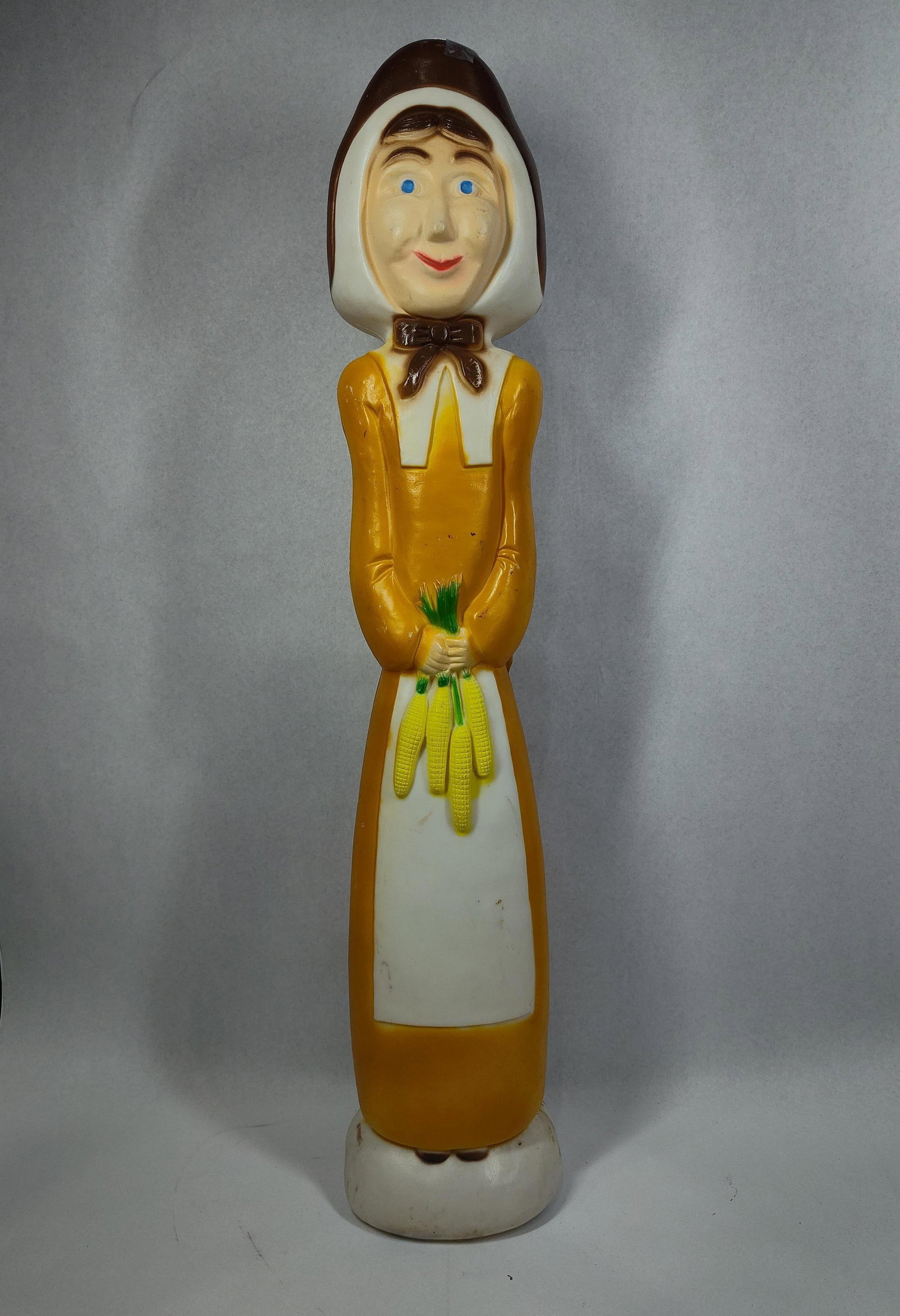 D. Featherstone Pilgrim Woman Blow Mold: 32in tall A vintage Thanksgiving-themed plastic blow mold decoration produced by Union Products and designed by artist Don Featherstone. The figure depicts a pilgrim woman in traditional dress,