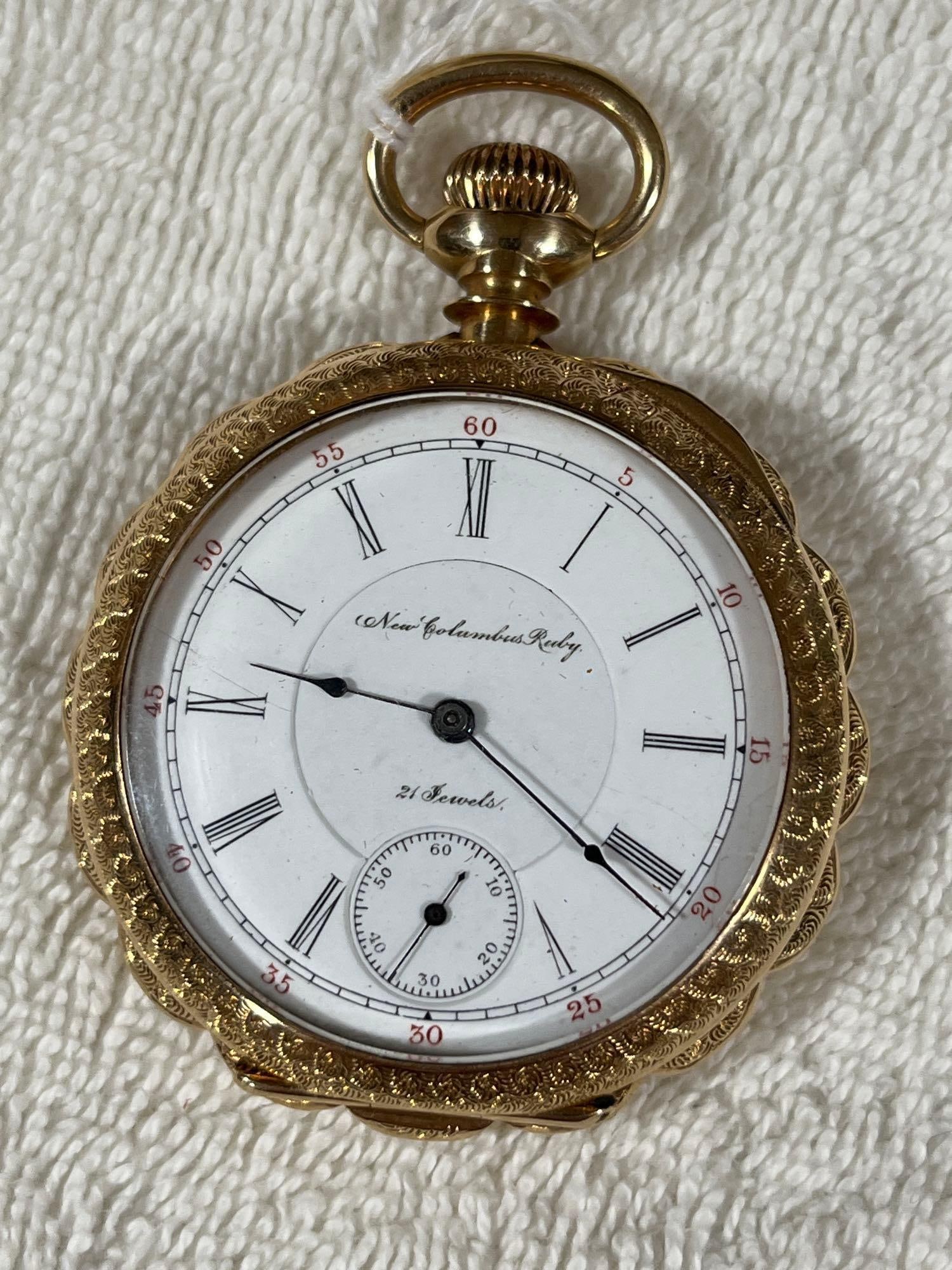 14 K Gold New Columbus Ruby Pocket Watch: Distinctive scalloped edge with 14K gold filled case. 21 jewel movement, serial number 351661. Working condition. 