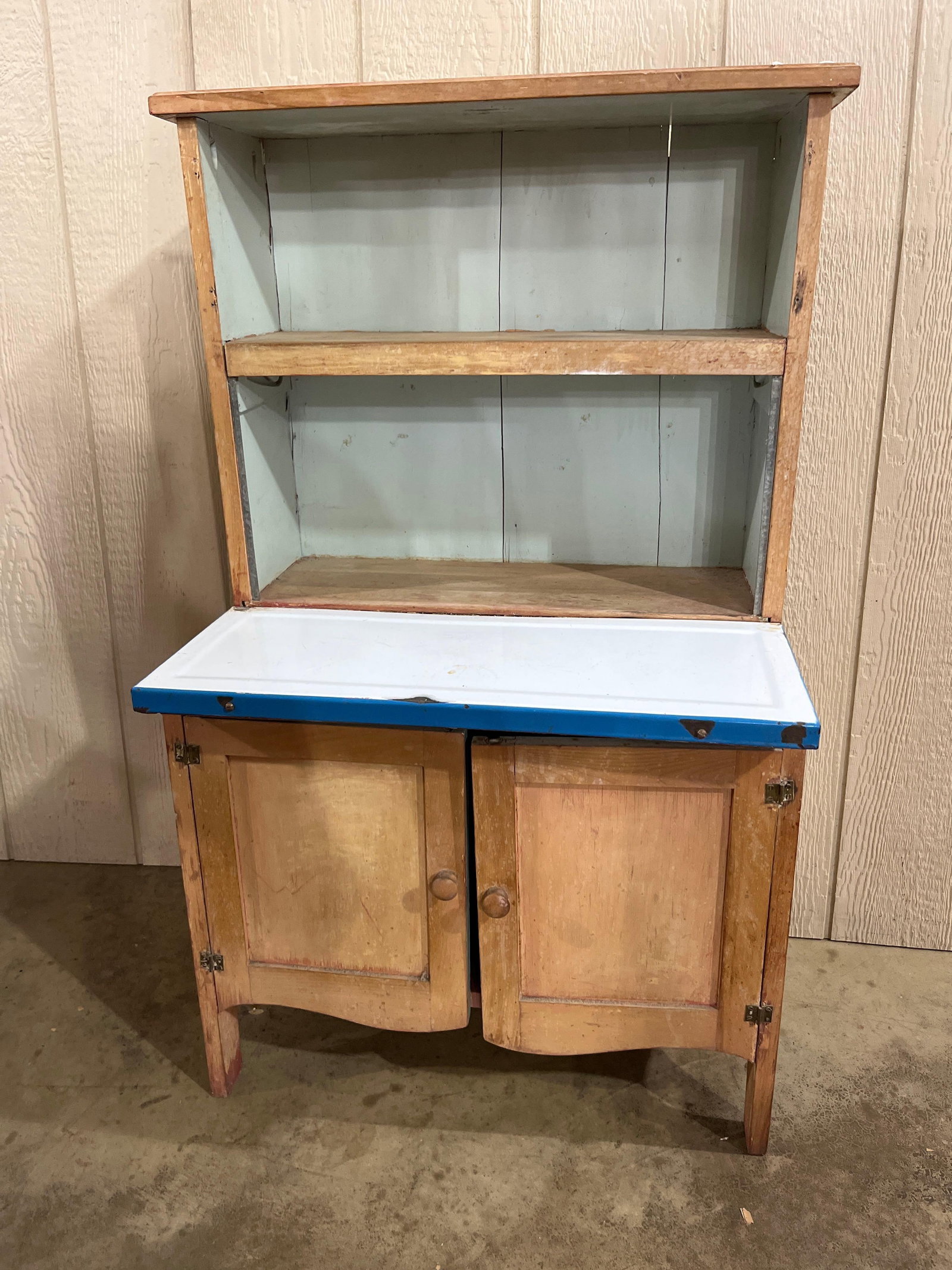 Early 20C Step-Back Cupboard w/ Enamel: 24x16x39 A two-piece step-back kitchen cupboard in the Hoosier style, likely dating from the early to mid-20th century. The unit is constructed of a softwood, appearing to be pine, and features a